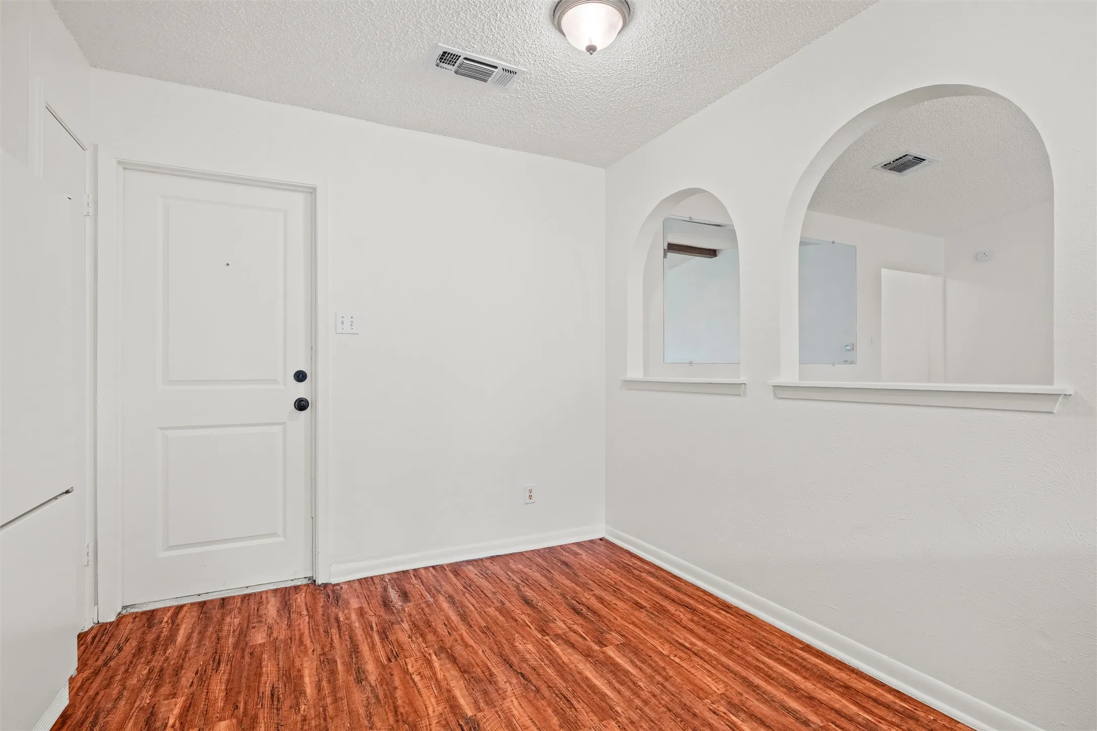 This bright bonus area near the kitchen is ready to become a breakfast nook, coffee bar, compact home office, or welcoming drop zone—the possibilities are wide open.