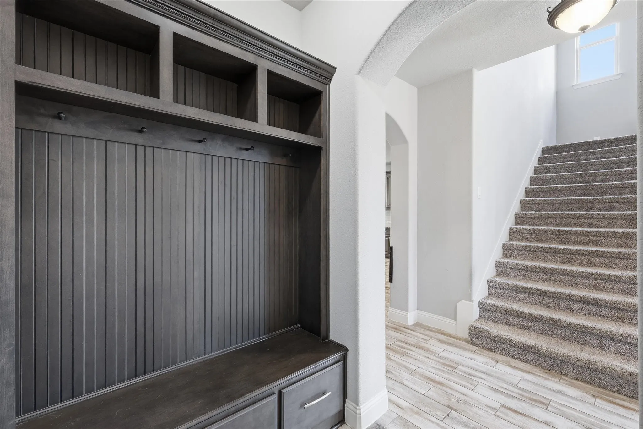 Mud room right off the 3 car garage is the perfect drop zone for backpacks and shoes.