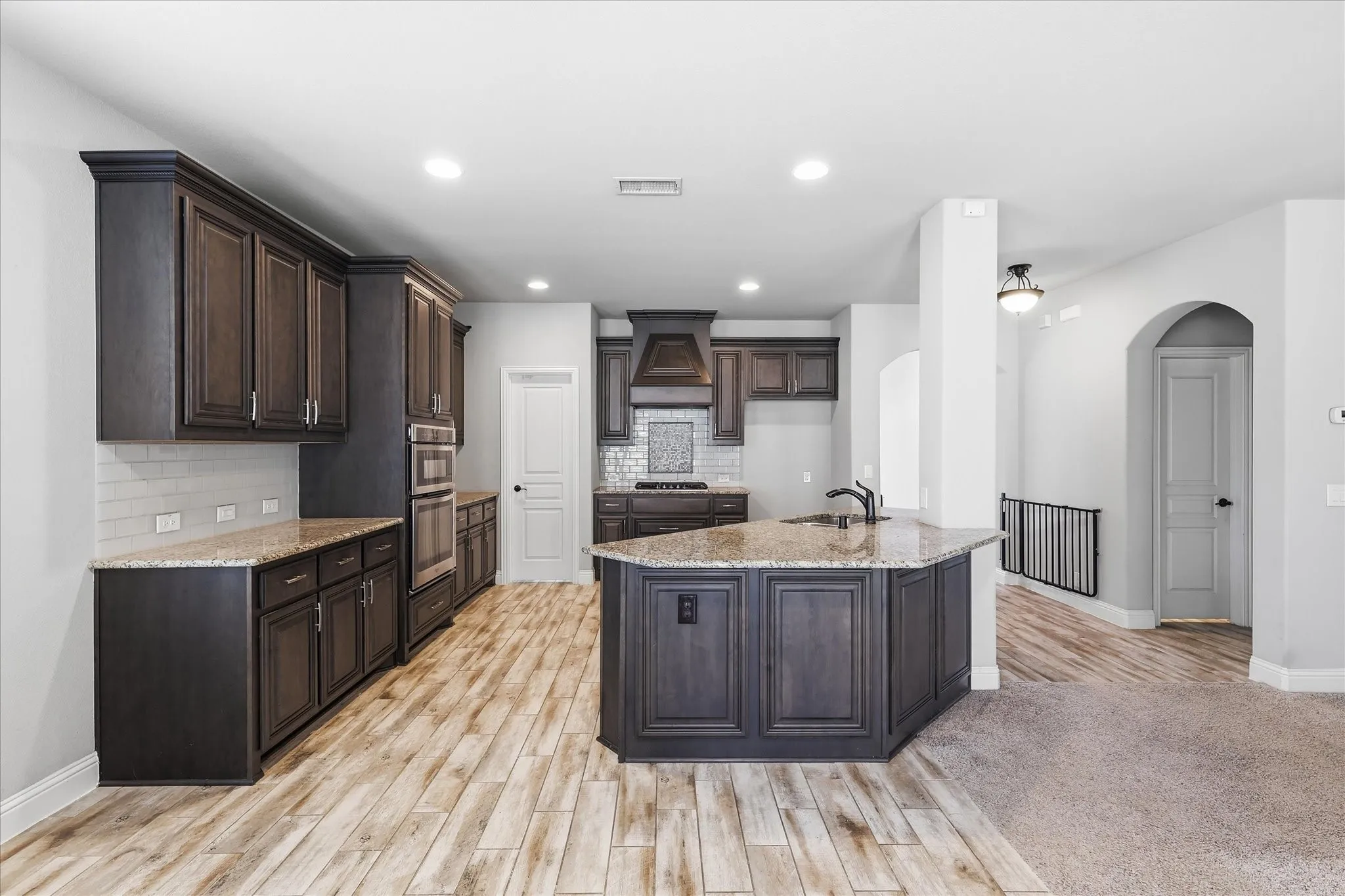 What's behind the door? A large walk in pantry with room for additonal shelving/storage