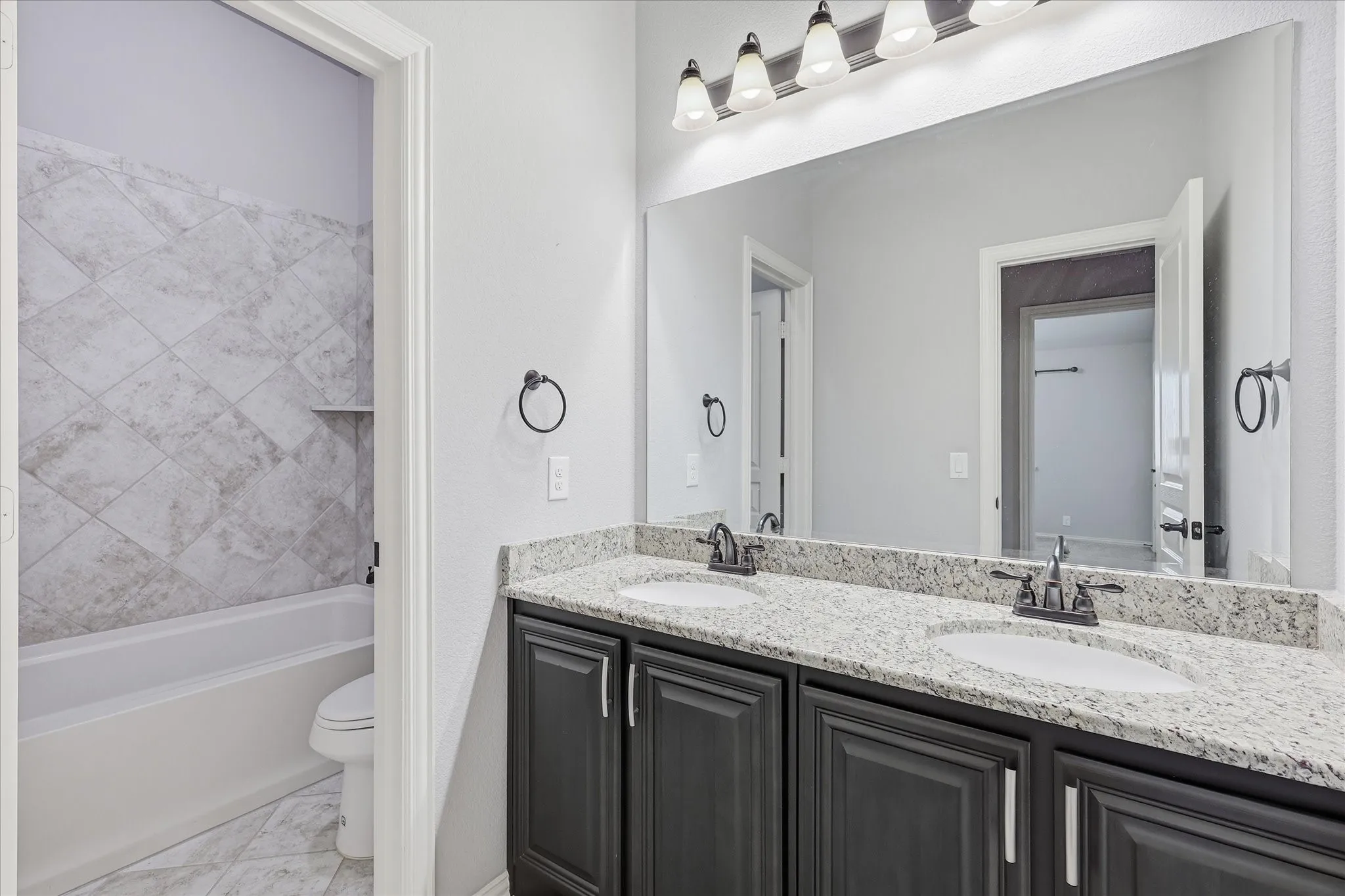 Full bathroom adjacent secondary bedroom down the hall.