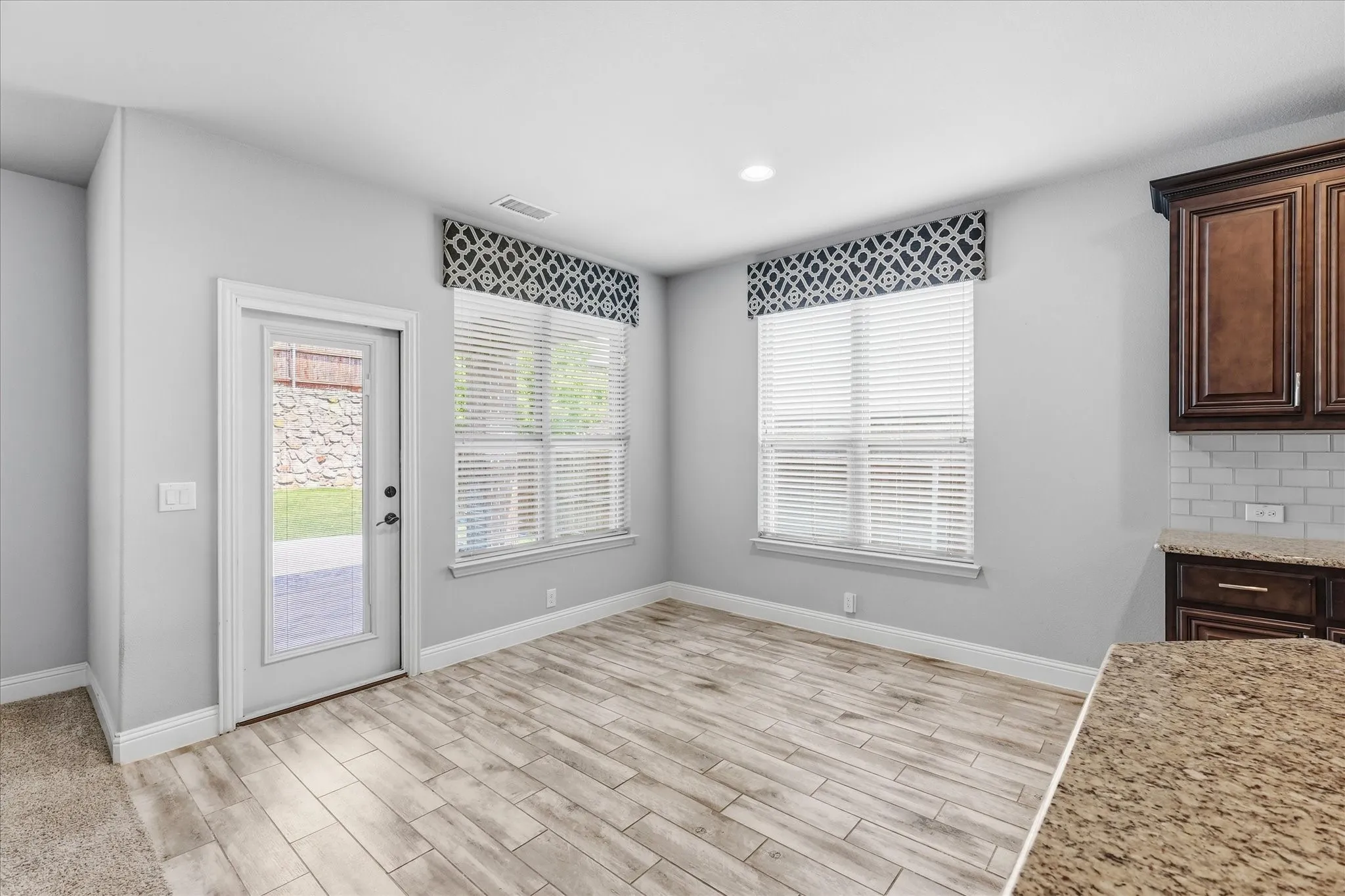 Eat in kitchen dining area that overlooks the backyard