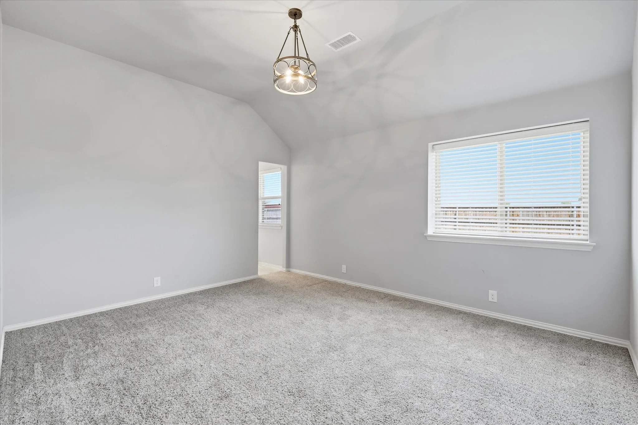 Seconday bedroom at the back of the home with large walk-in closet and jack and jill bathroom