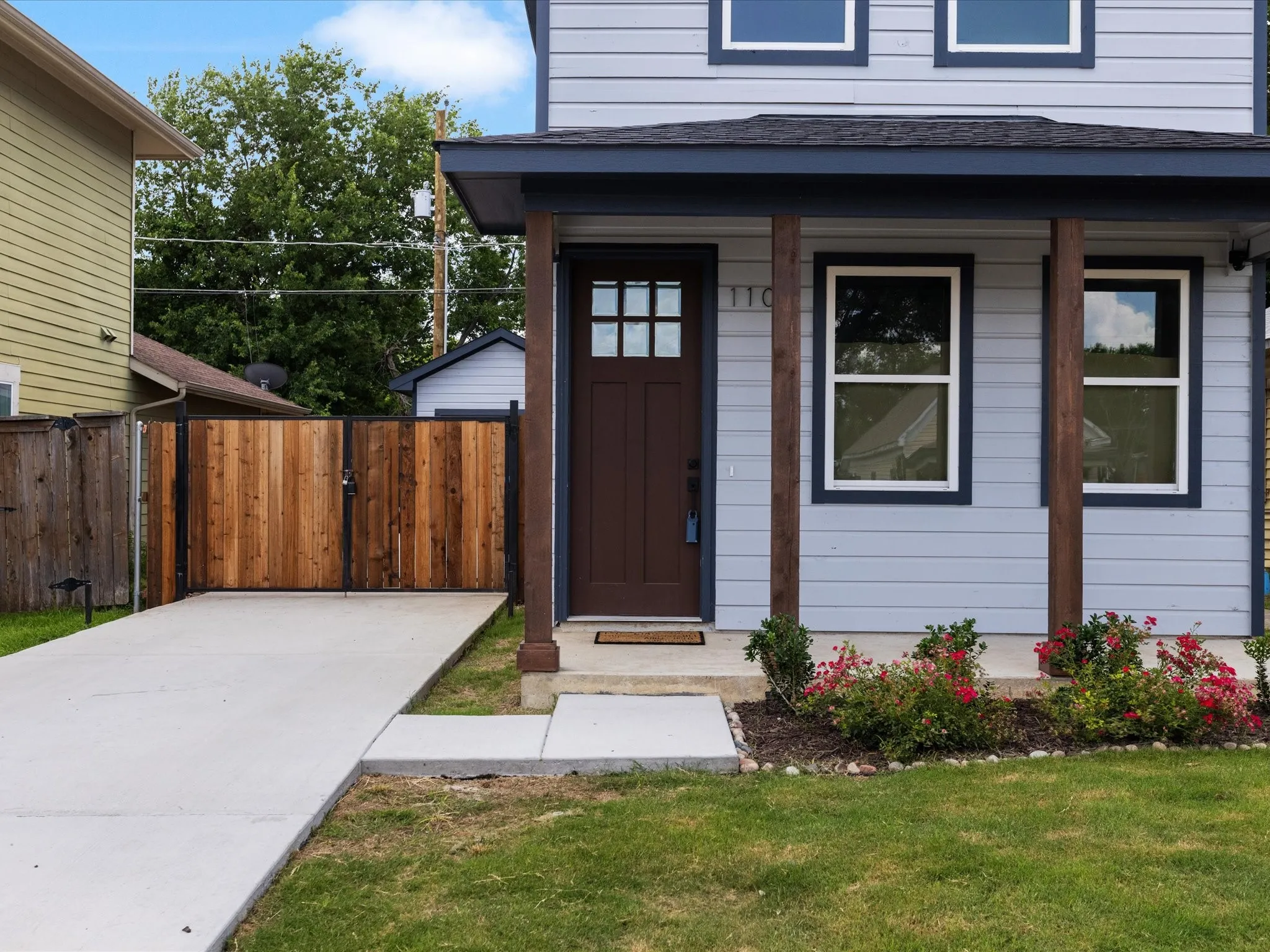 Light blue siding exterior with dark trim accents