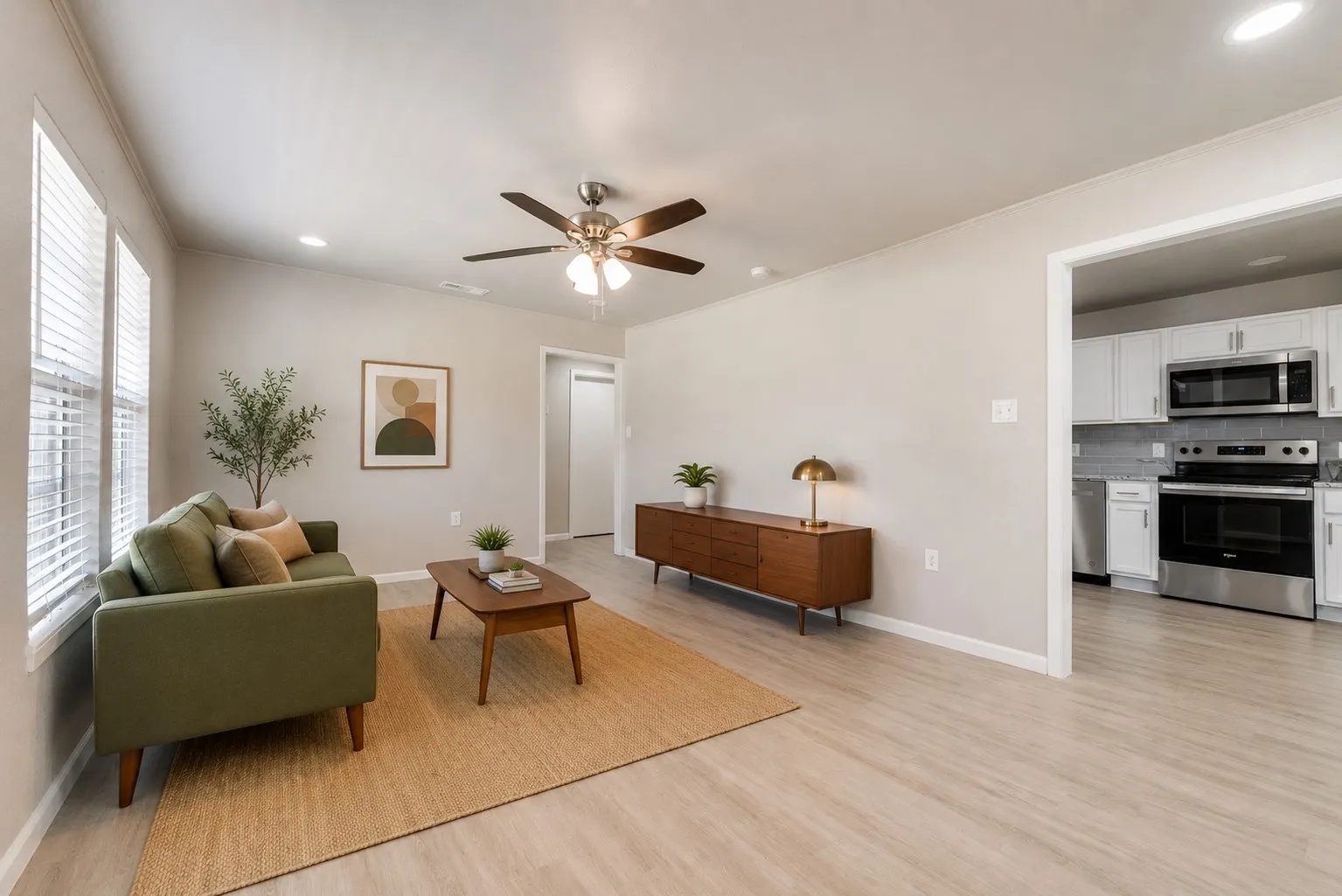 Living area featuring light wood-finish flooring, recessed lighting, and a ceiling fan