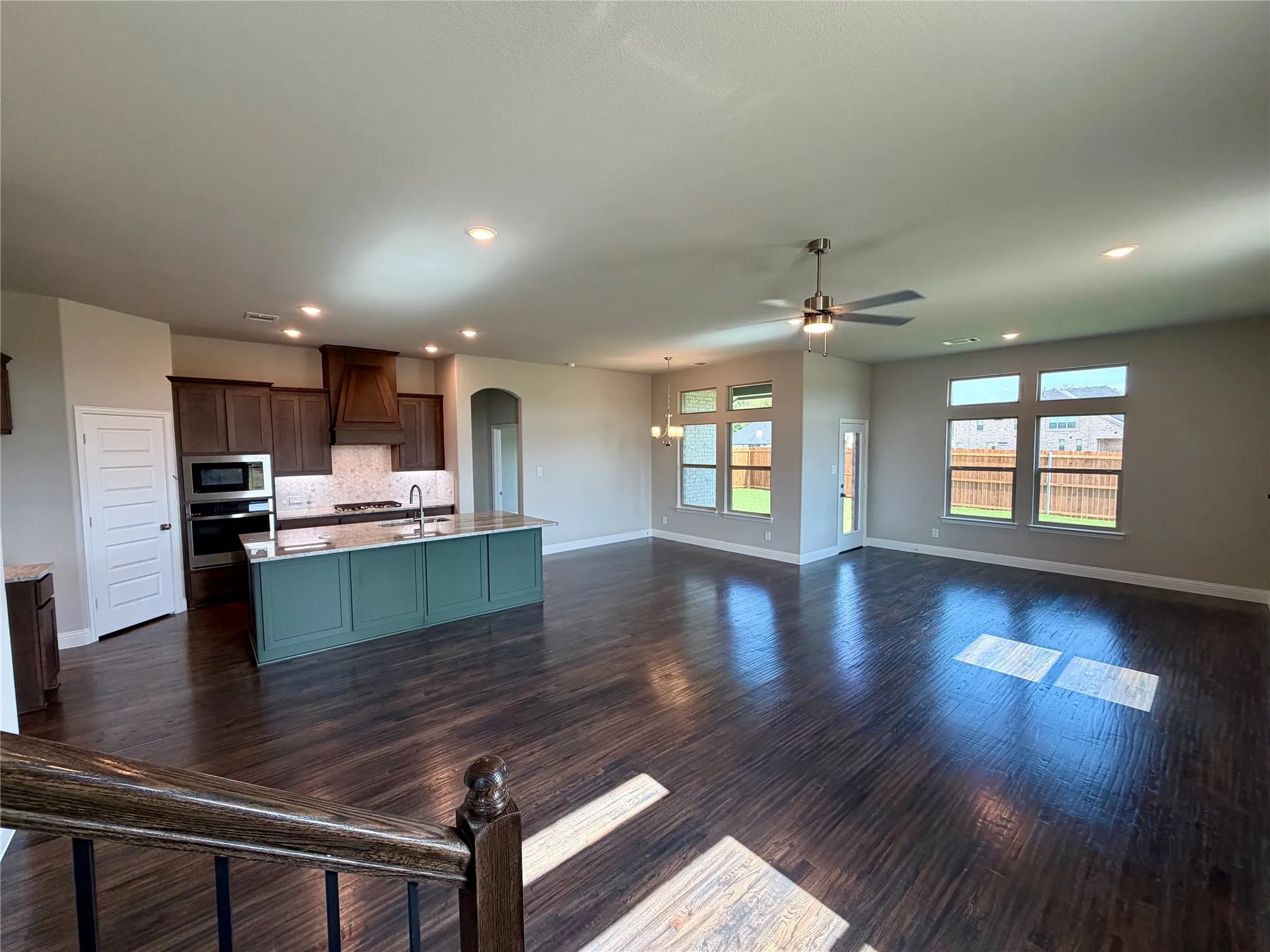Massive great room with rich hardwood floors and lots of windows!