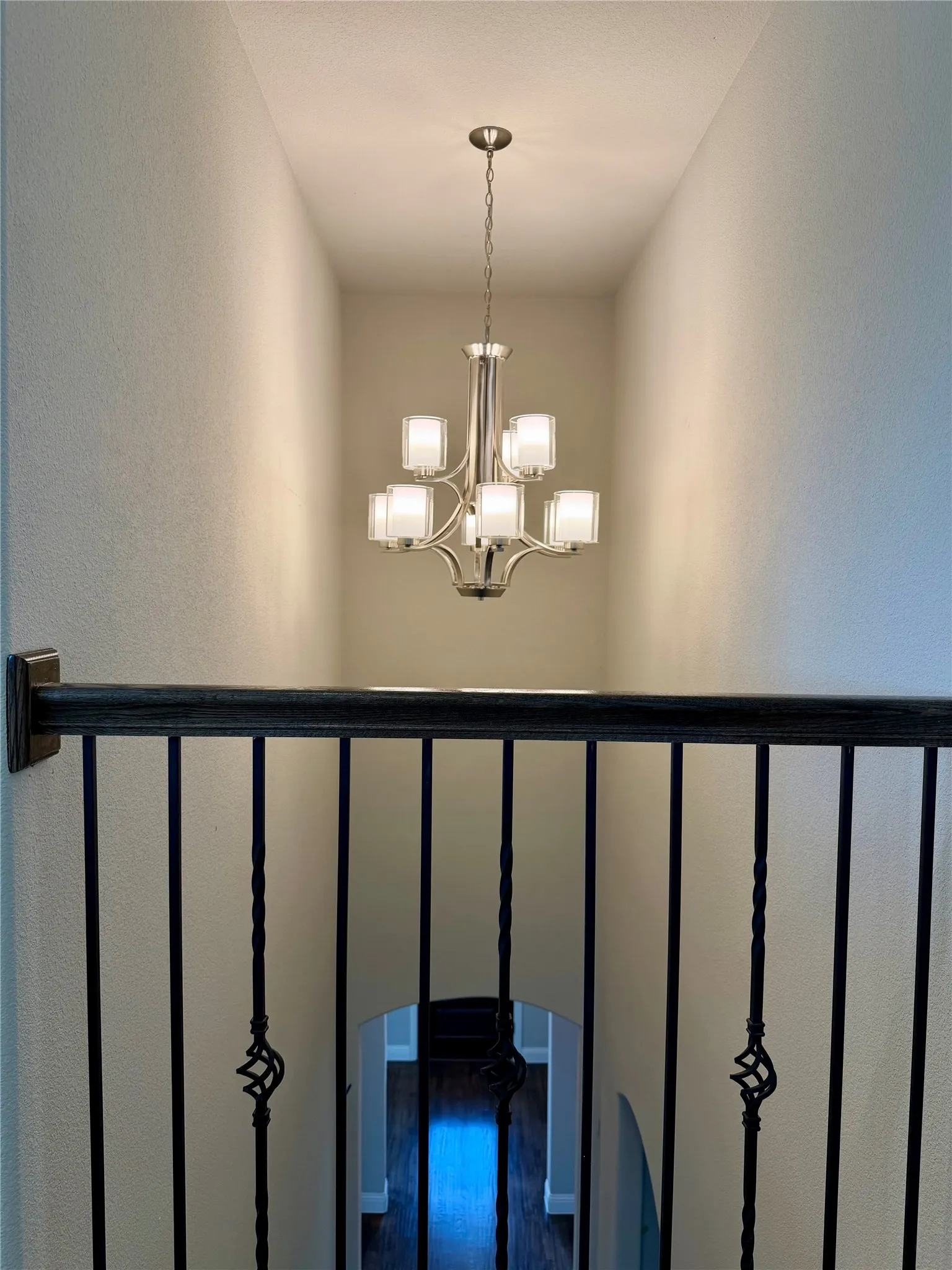 Wrought iron Juliet balcony looking down one the entry from the gameroom