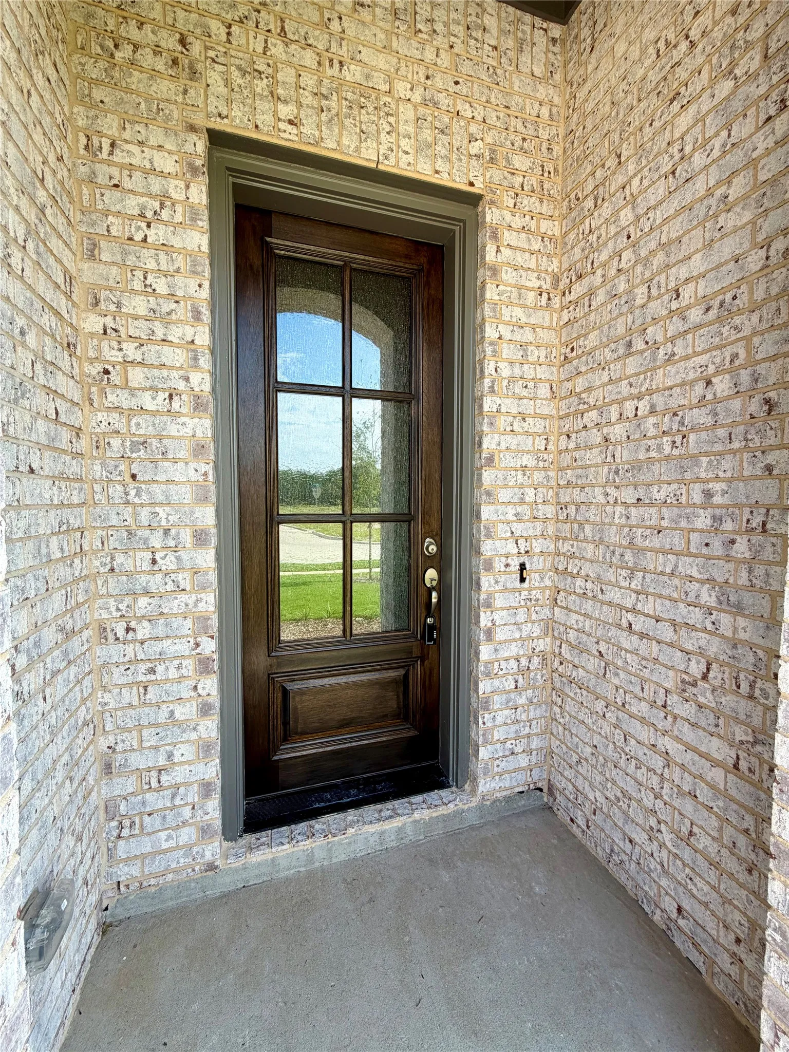 Mission style rain glass front door makes a great first impression