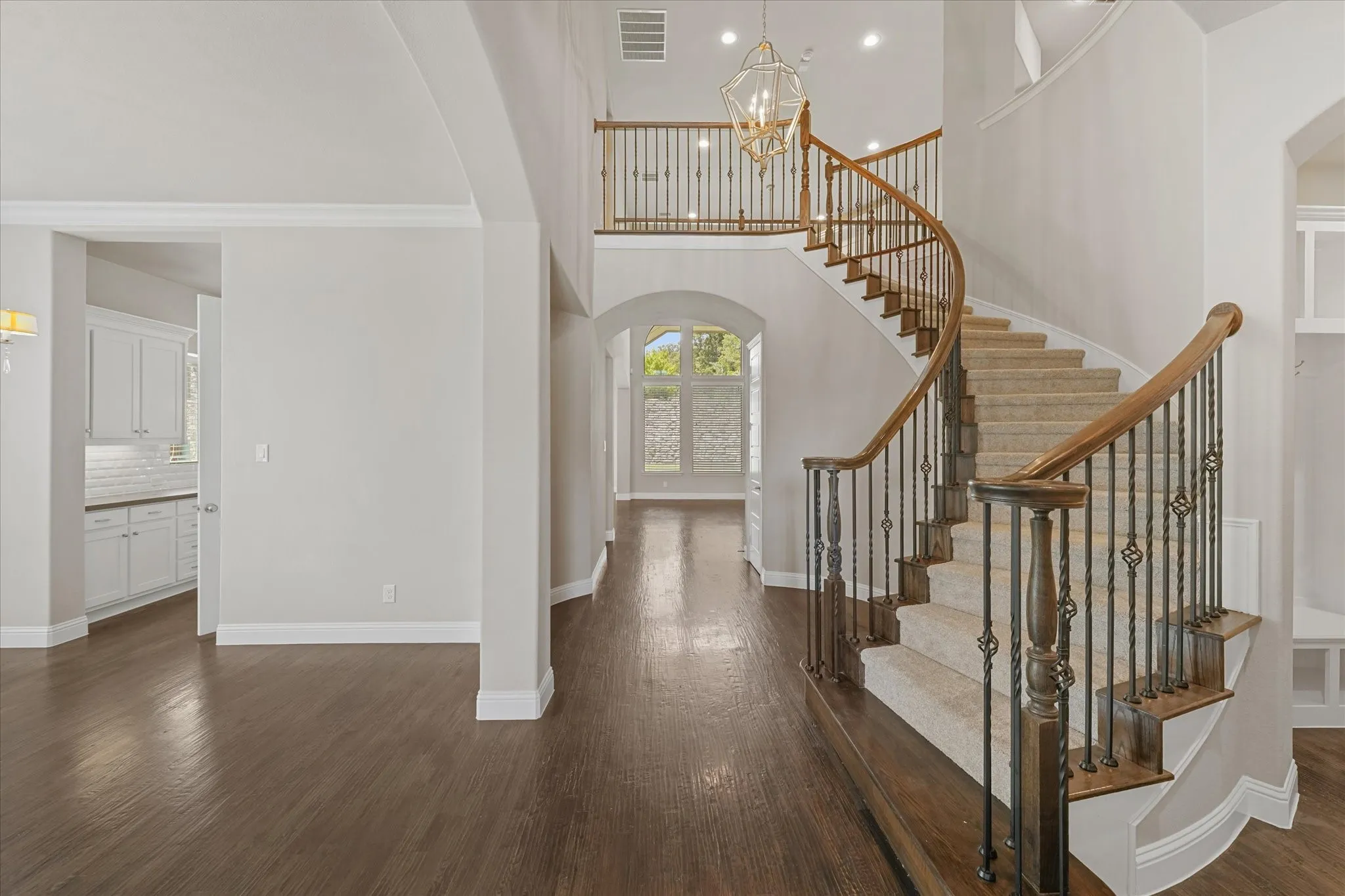 The home features fresh paint throughout on every surface of the 4,971 sq ft home! (walls, ceiling, doors, trim, baseboards, molding, cabinets, etc) It shines like new! This entire home has been refreshed with even new carpet on the upper level too! First floor showcases hand scraped hardwood floors. Kitchen features built in SS appliances, a gas cooktop, tons of storage, granite and quartz countertops, a deep farmhouse sink, gorgeous lighting fixtures, an island with room for barstools, eat in kitchen, open floor plan, and more!