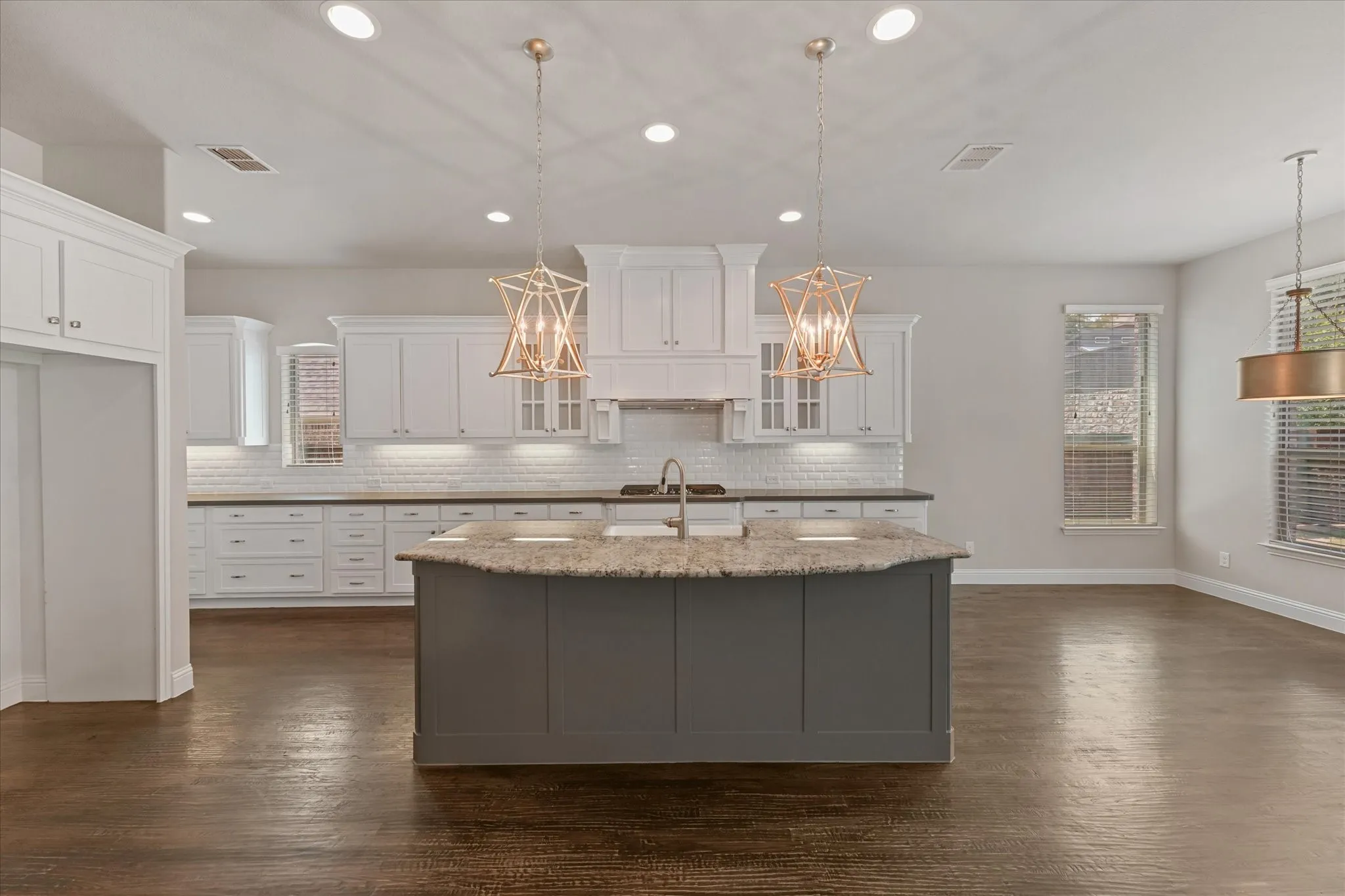 The home features fresh paint throughout on every surface of the 4,971 sq ft home! (walls, ceiling, doors, trim, baseboards, molding, cabinets, etc) It shines like new! This entire home has been refreshed with even new carpet on the upper level too! First floor showcases hand scraped hardwood floors. Kitchen features built in SS appliances, a gas cooktop, tons of storage, granite and quartz countertops, a deep farmhouse sink, gorgeous lighting fixtures, an island with room for barstools, eat in kitchen, open floor plan, and more!