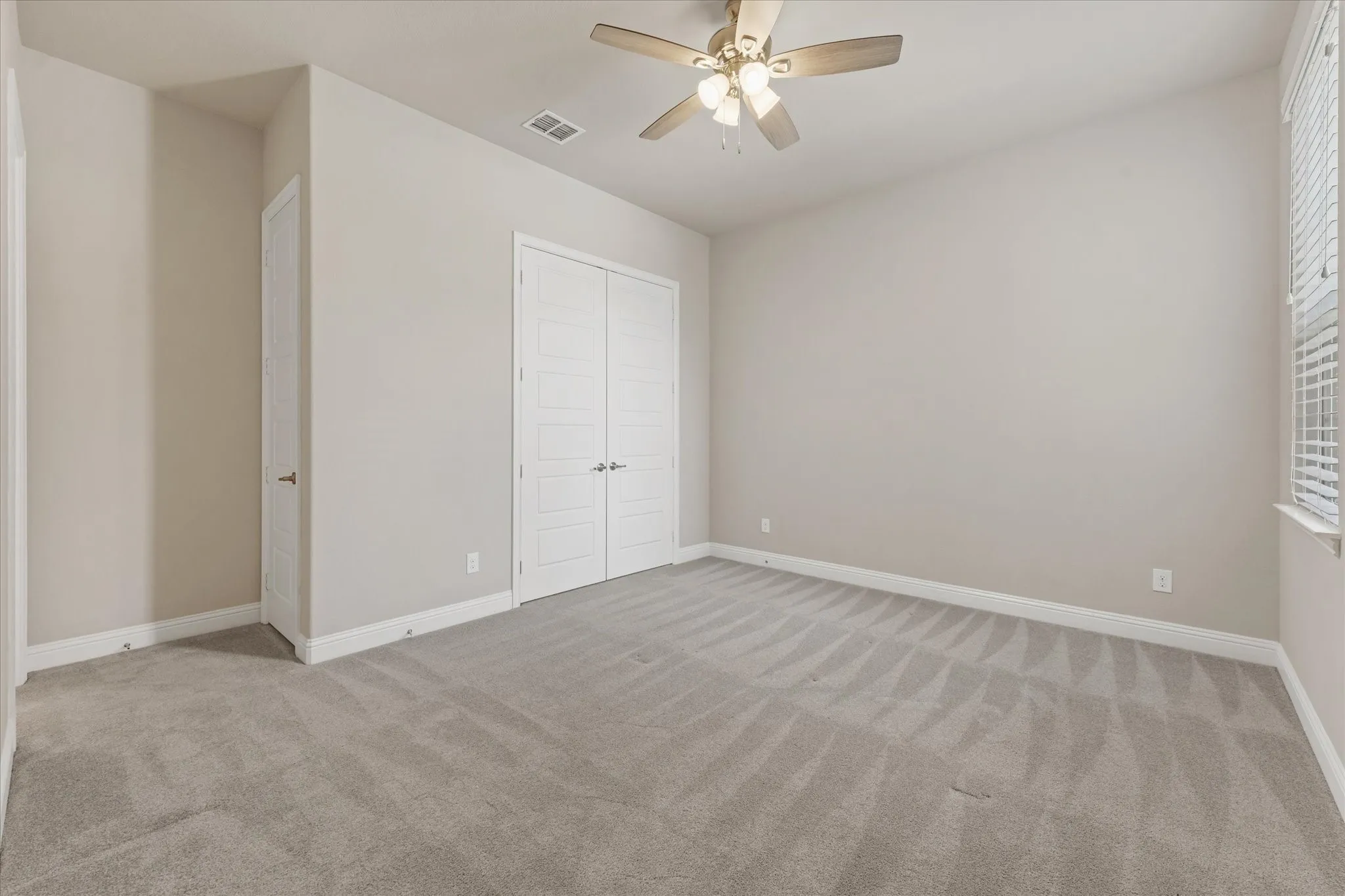 Second bedroom (second primary or mother in law wing on first level with ensuite bath)