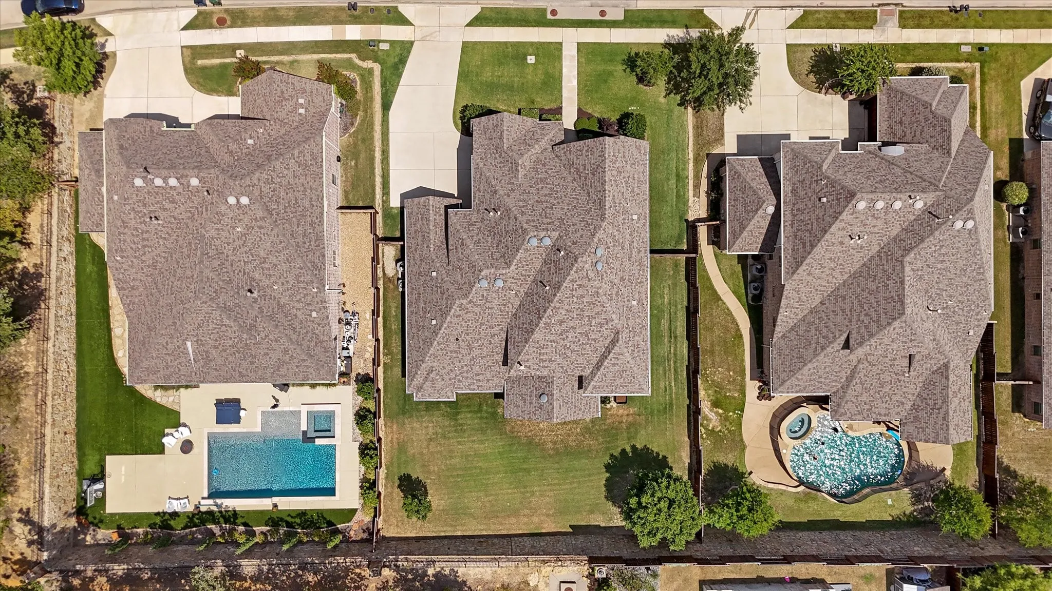 This yard is huge as the home sits on over a quarter acer lot! There is room here for endless ideas like a great pool and more. The stone wall and stained fence are in great condition. The yard is well maintained. The backyard backs up to a greenbelt for extra quiet and privacy.