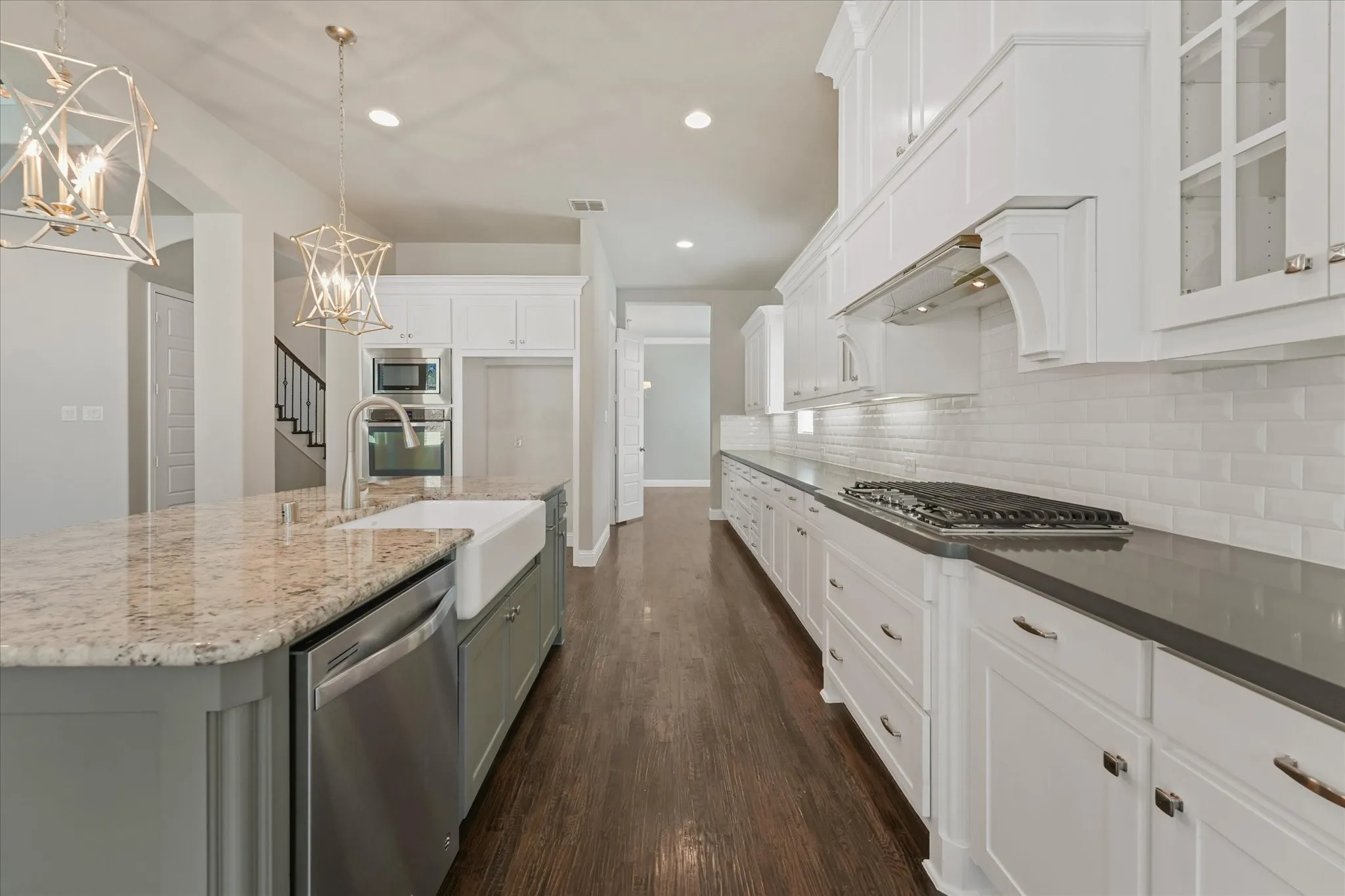 The home features fresh paint throughout on every surface of the 4,971 sq ft home! (walls, ceiling, doors, trim, baseboards, molding, cabinets, etc) It shines like new! This entire home has been refreshed with even new carpet on the upper level too! First floor showcases hand scraped hardwood floors. Kitchen features built in SS appliances, a gas cooktop, tons of storage, granite and quartz countertops, a deep farmhouse sink, gorgeous lighting fixtures, an island with room for barstools, eat in kitchen, open floor plan, and more!