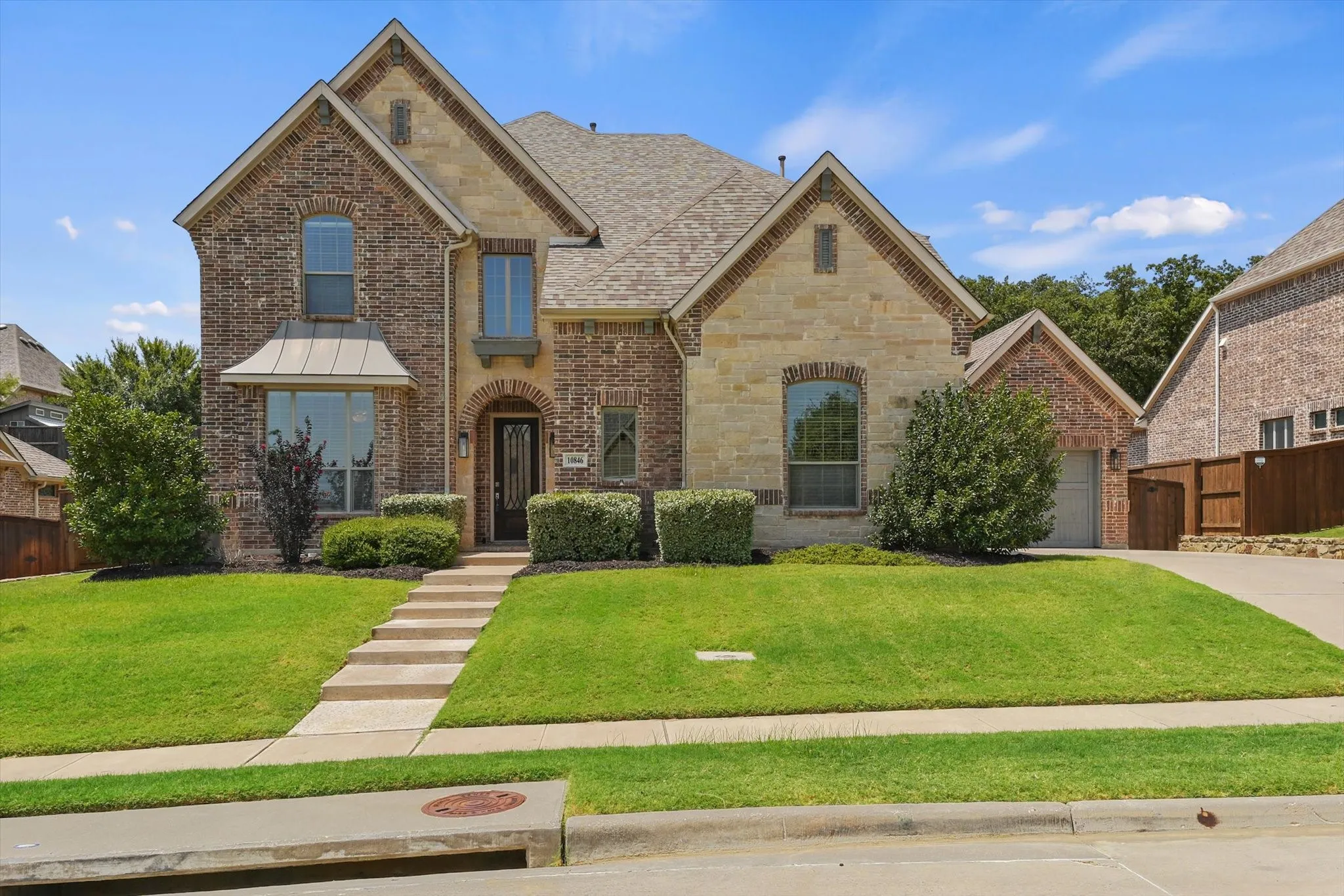 This gorgeous almost 5,000 sqft home features a 3 car garage, a gorgeous brick and stone elevation, over a quarter acre lot that backs up to a quiet greenbelt for extra privacy, and the perfect layout with two of the five bedrooms on the first floor, as well as a dedicated office!