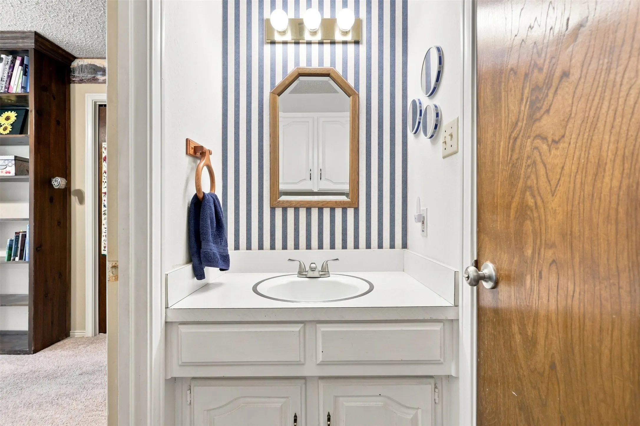 Half Bathroom, off the garage and kitchen.