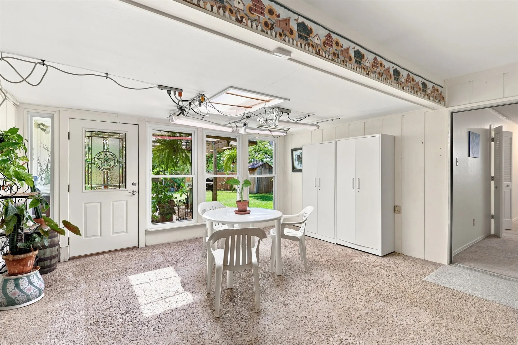 Enclosed sunroom overlooking the backyard.