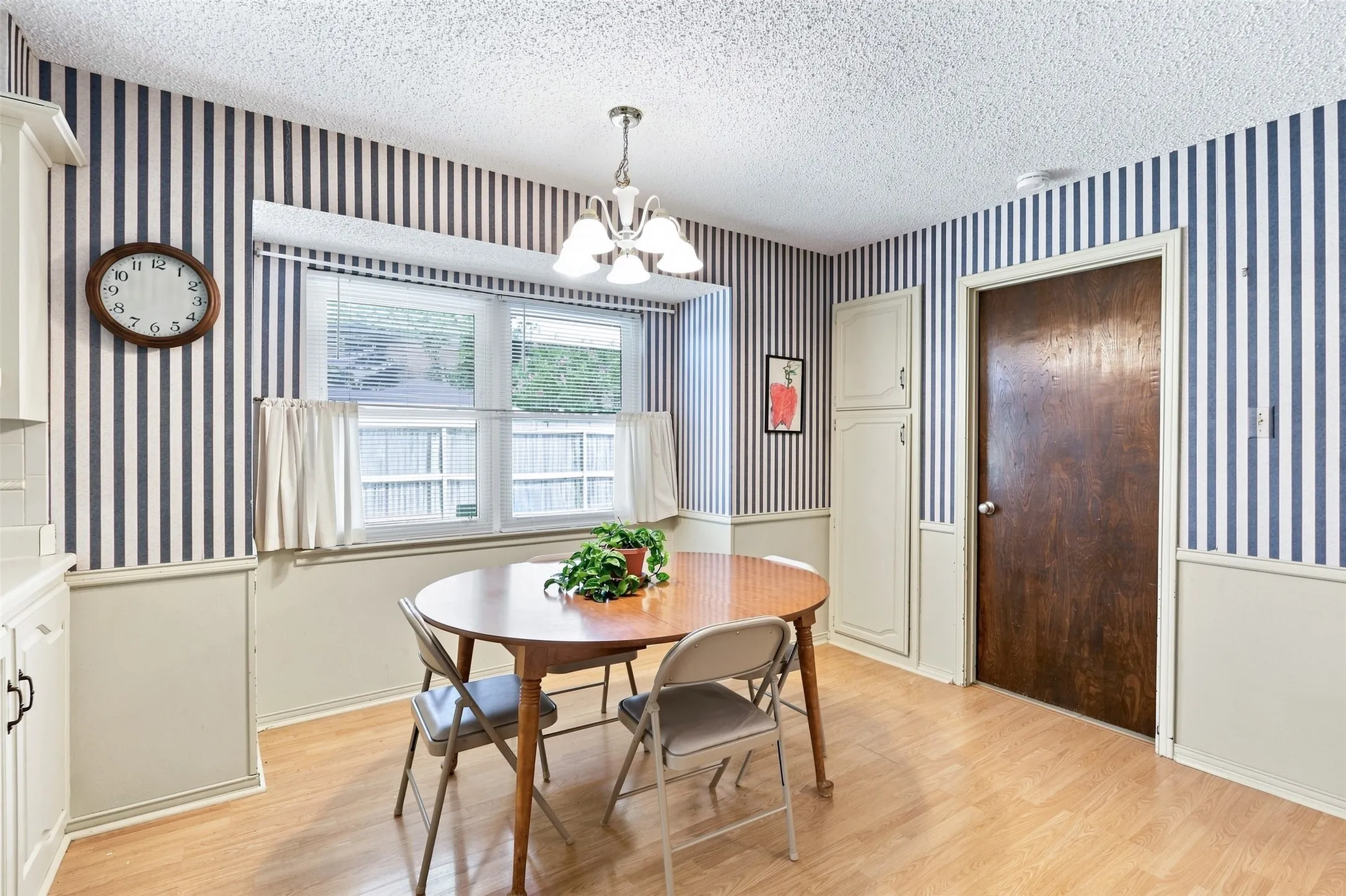 Eat-in kitchen area with built-ins for additional storage.