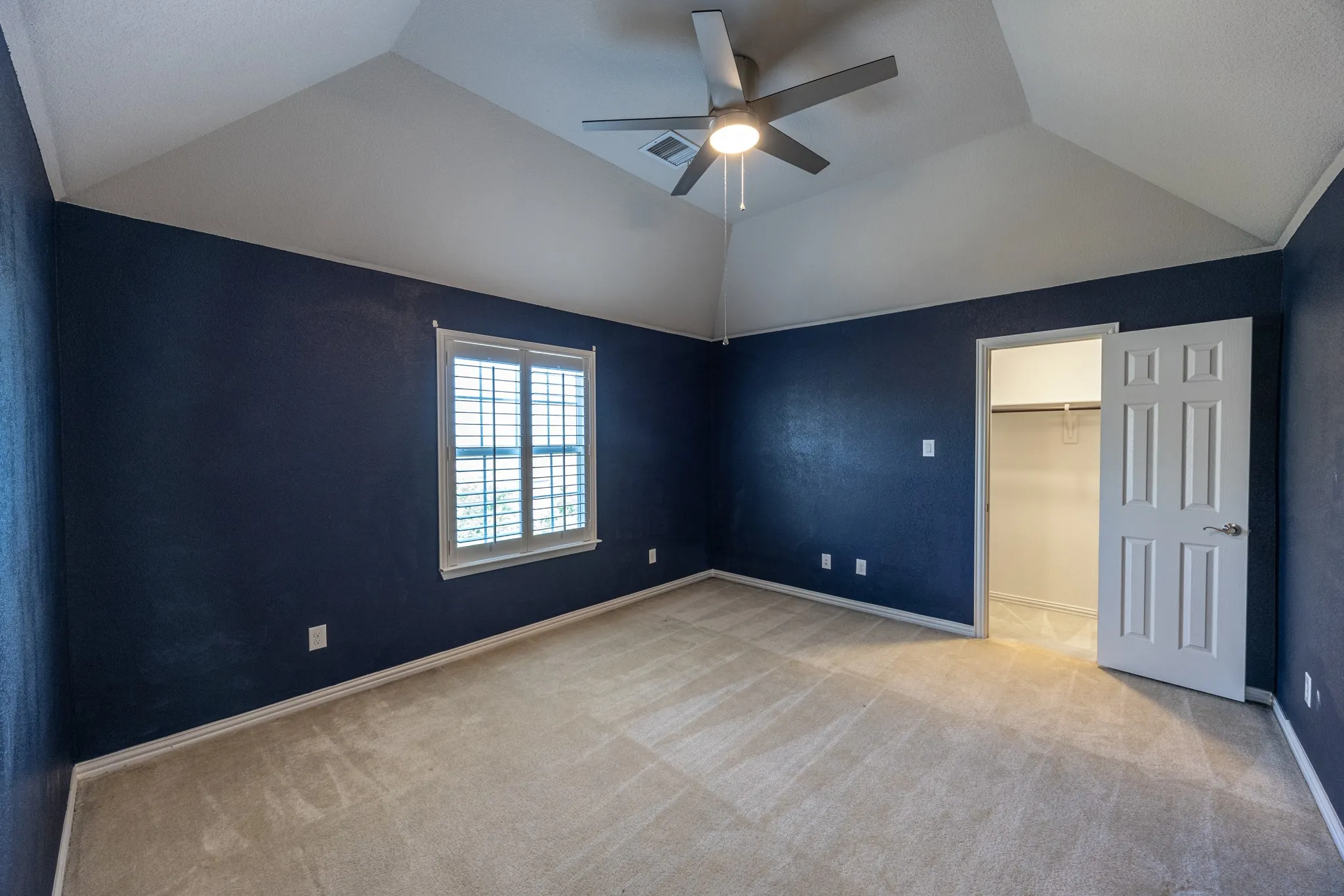 Bedroom #4
Bedroom featuring a vaulted ceiling with a ceiling fan and light fixture