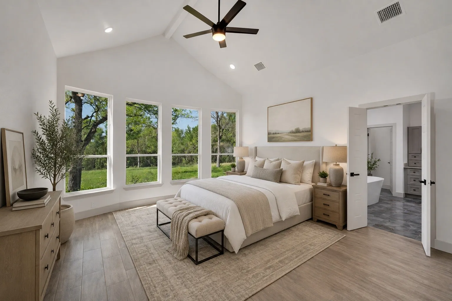 Vaulted ceiling with a ceiling fan, recessed lighting, and wood-finish flooring