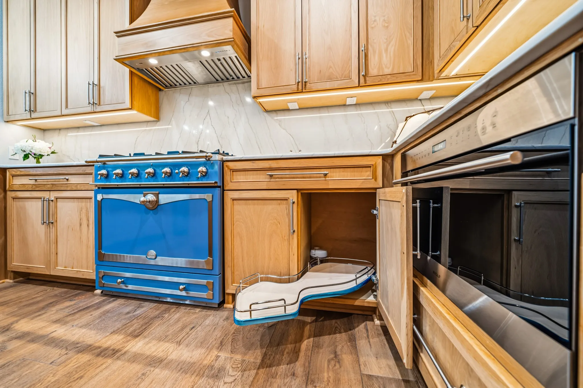 French Provence Blue "La Cornue" gas range, peanut-shaped LazySusan pullouts, & Wolf Convection Oven