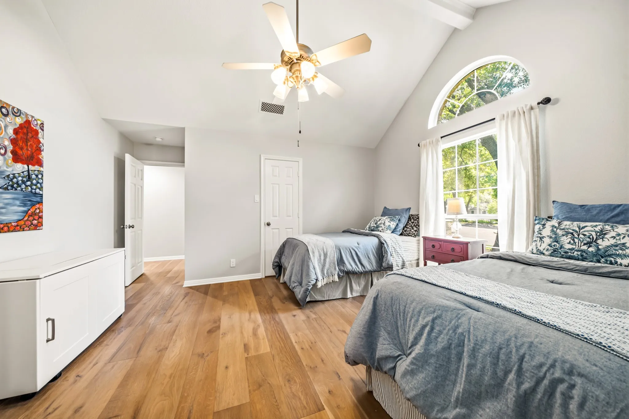 Bedroom #3 has vaulted & beamed ceiling and entrance to bathroom