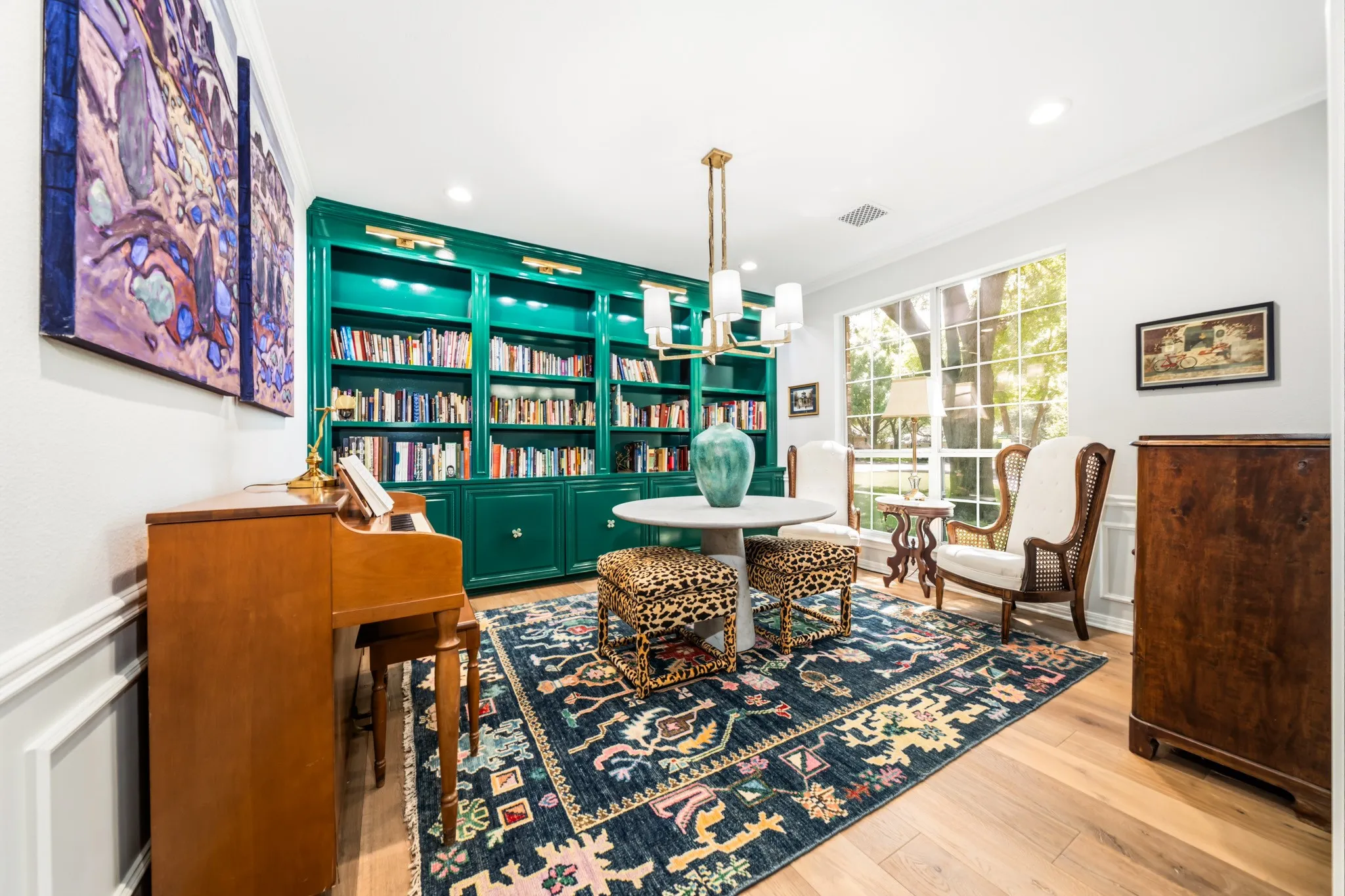 High-gloss emerald green bookcases have cabinets, with lit pull-outs, below (for housing your turn-table and album collection).