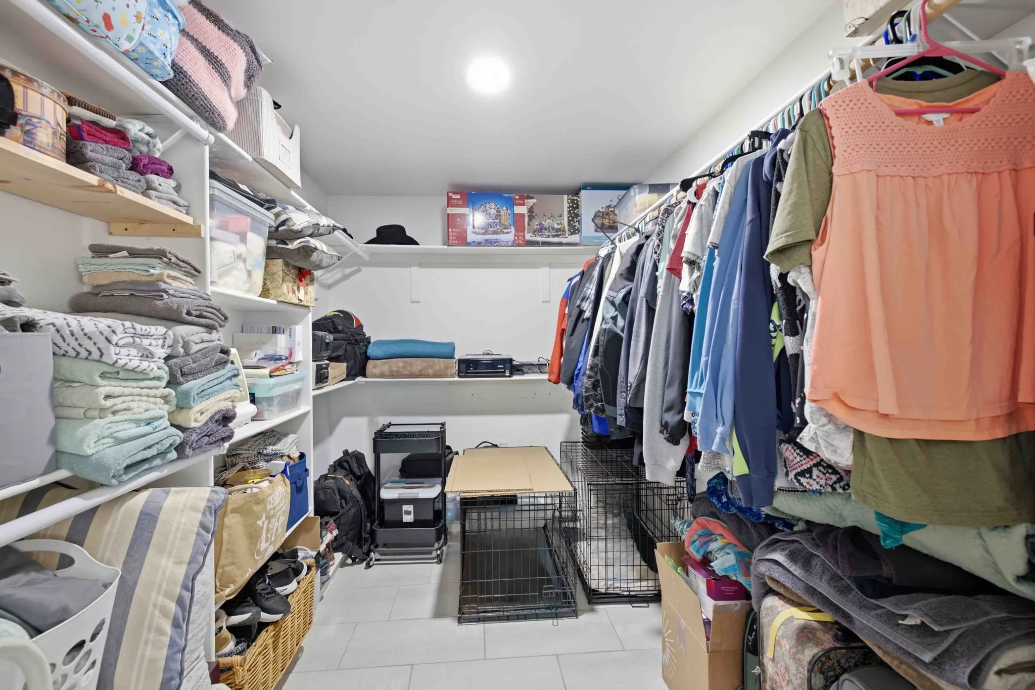 Recessed lighting illuminates extensive built-in shelving, providing generous storage solutions