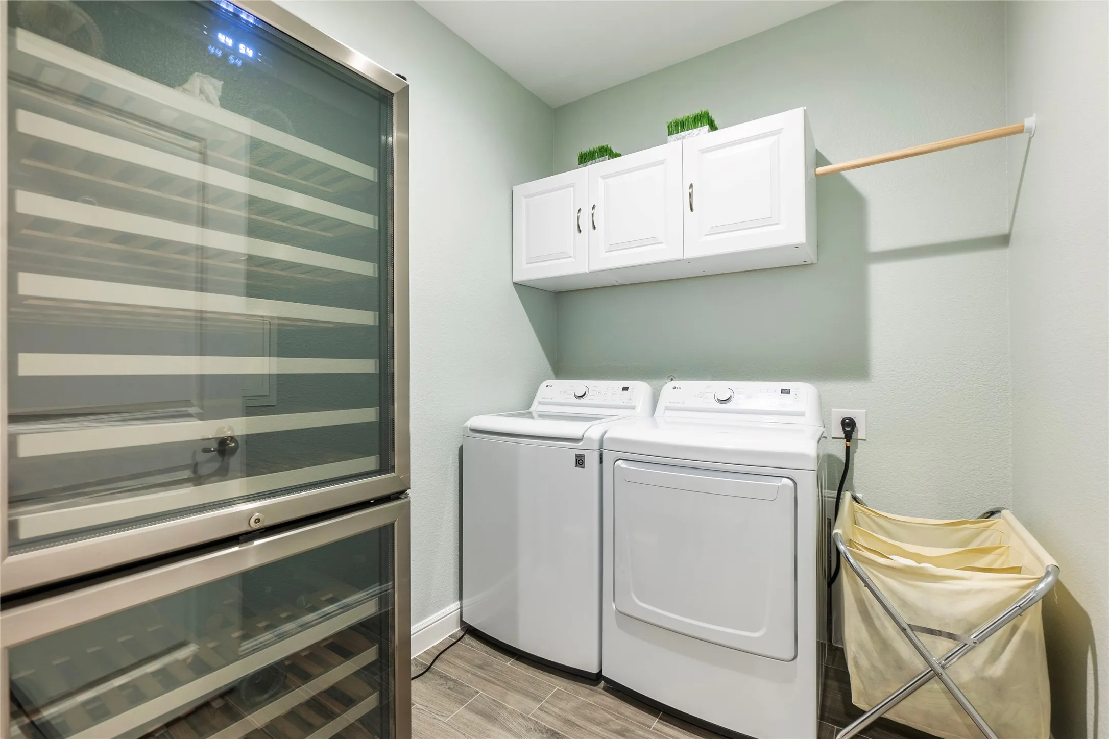 Laundry area with built-in shelves & drip dry rod