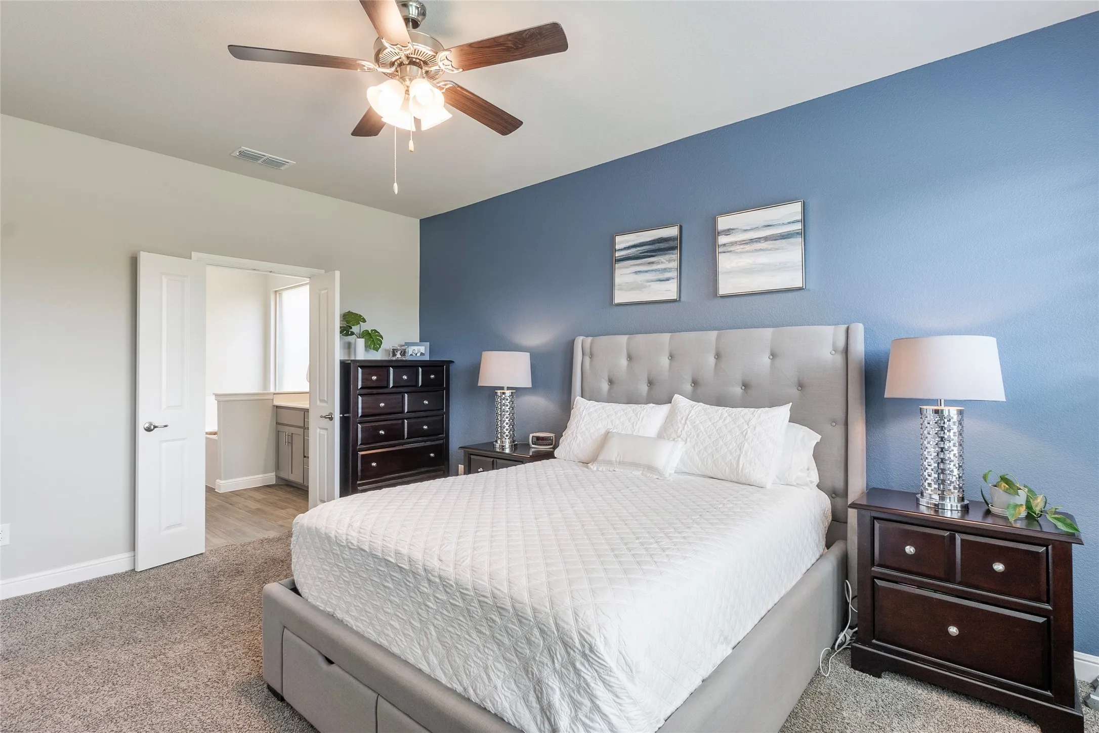 Bedroom has french doors to primary bath