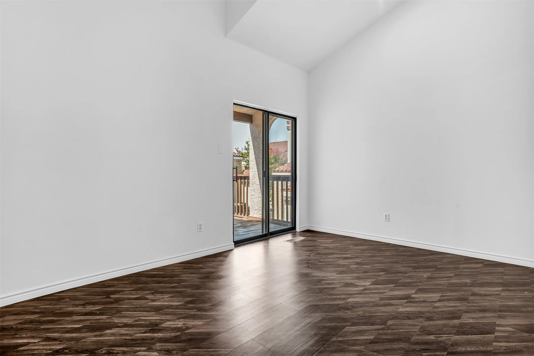 Vaulted ceiling with wood-finish flooring