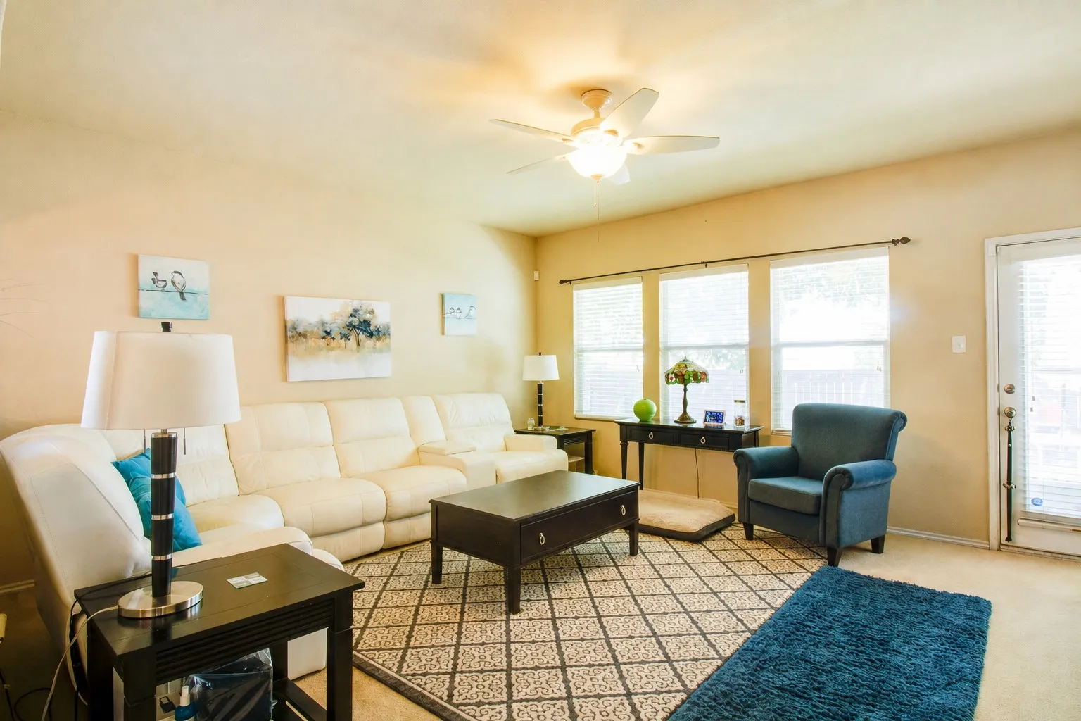 Recessed lighting, ceiling fan, multiple windows with blinds, and light-toned walls