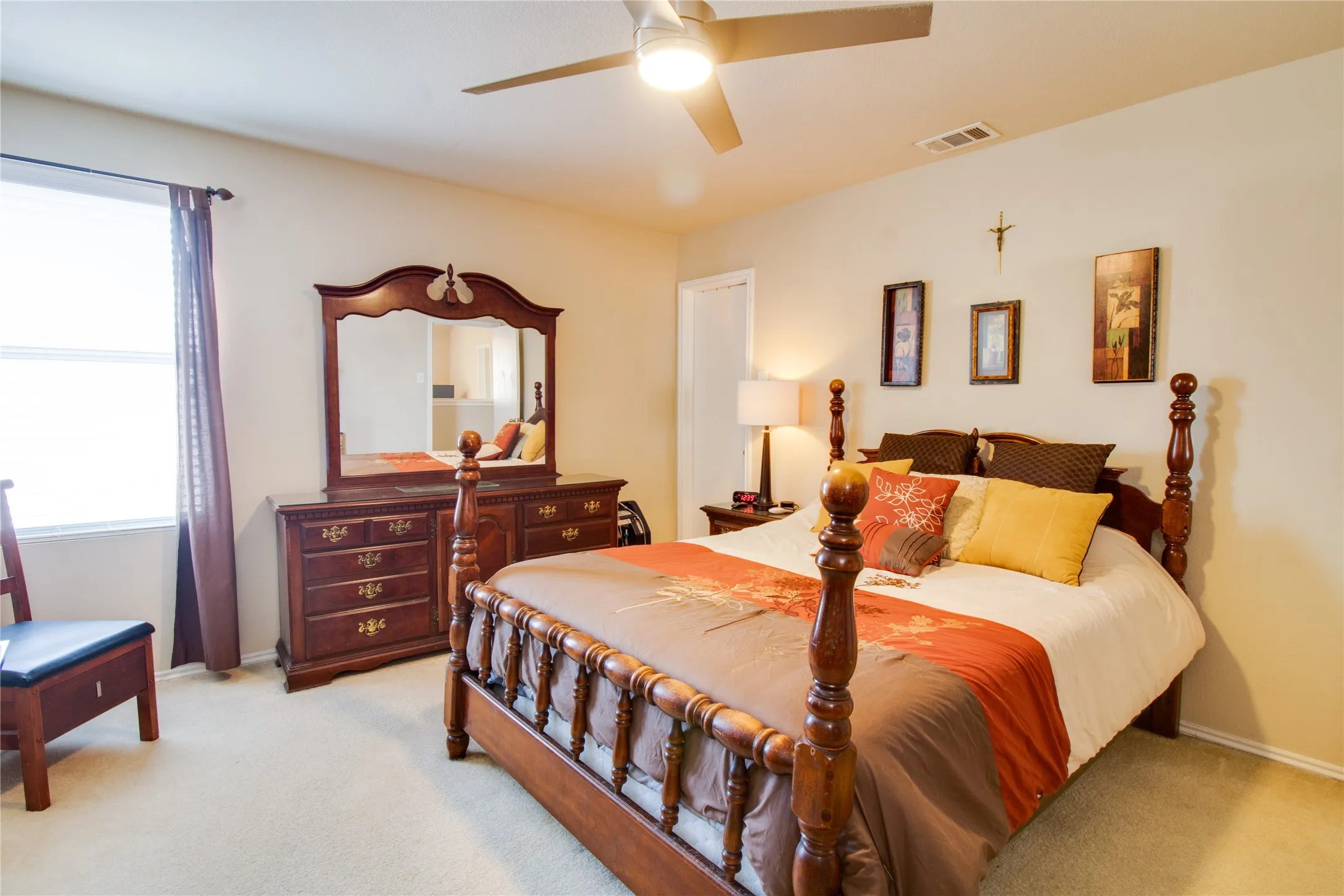 Bright room with neutral wall tones and carpeted flooring