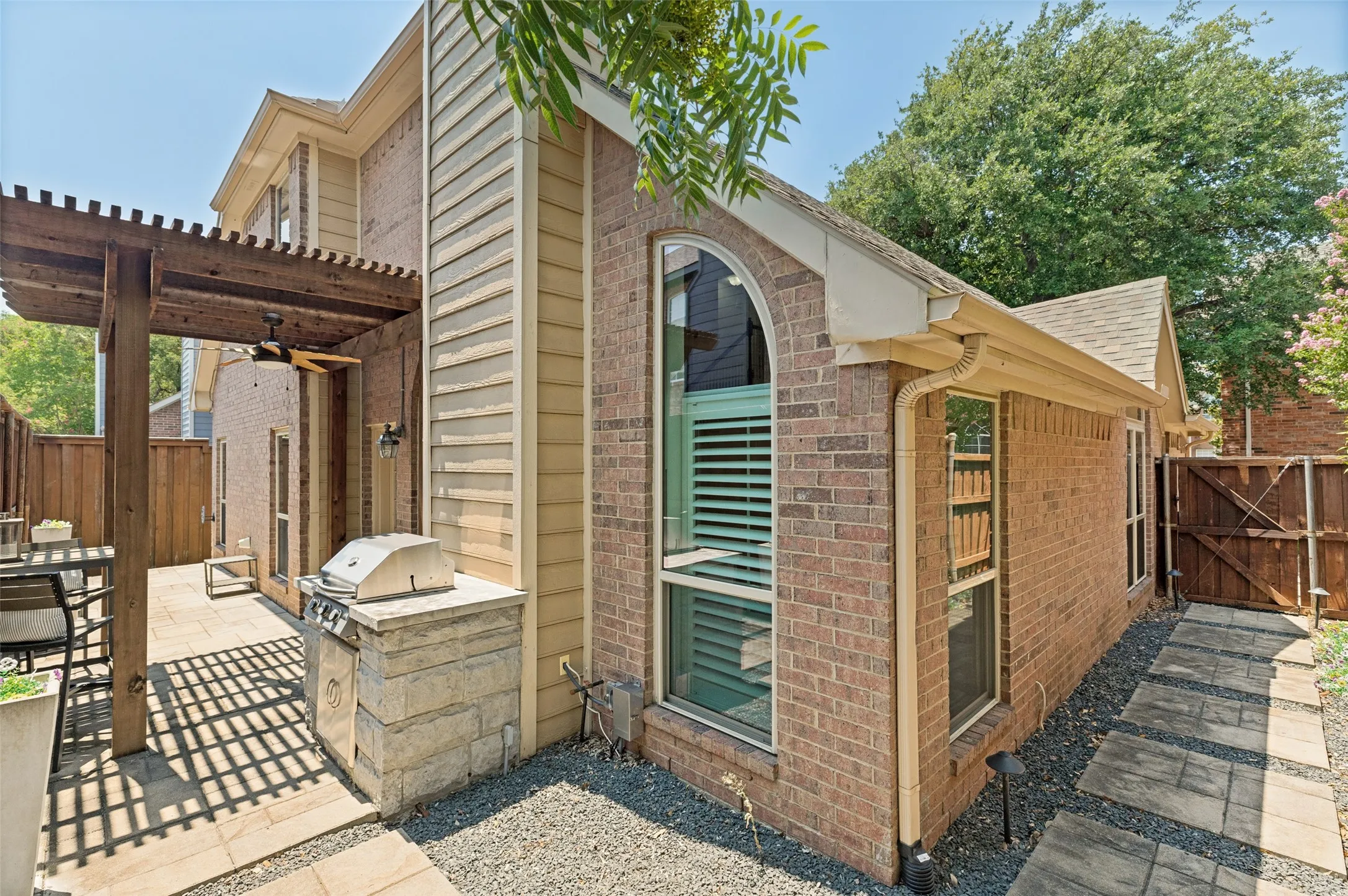 Inviting Backyard with Covered Patio and Built-in Gas Grill