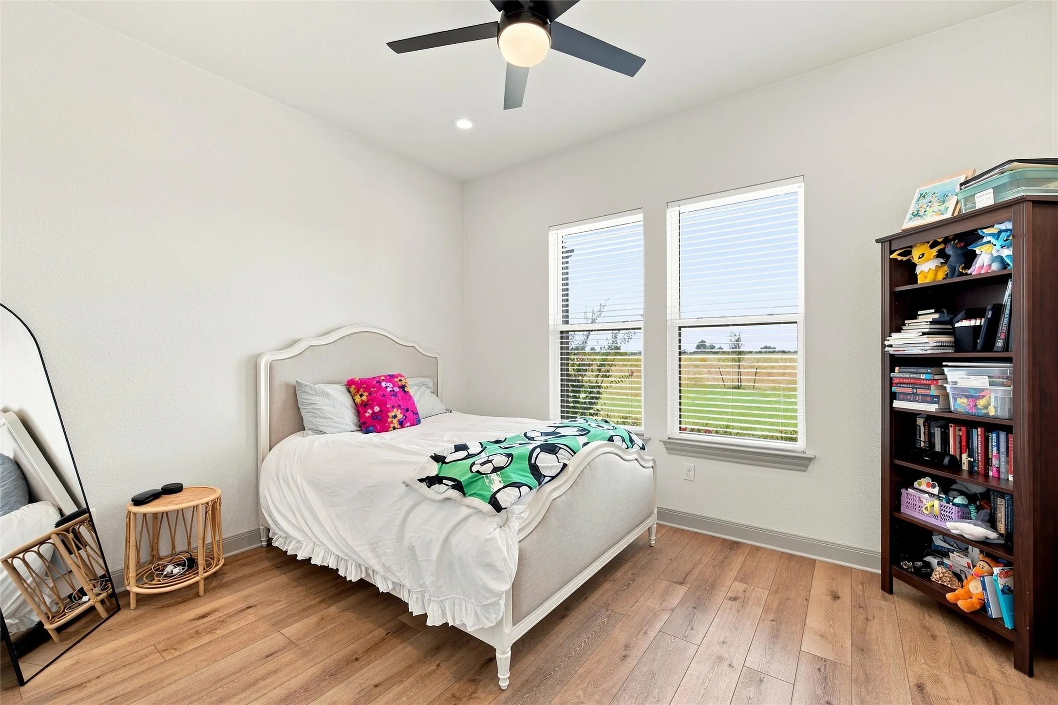 Bright interior space featuring wood-finish flooring and white walls