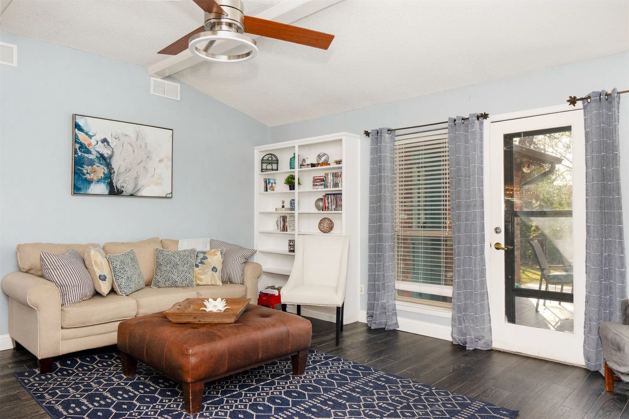 Vaulted ceiling with a contemporary ceiling fan