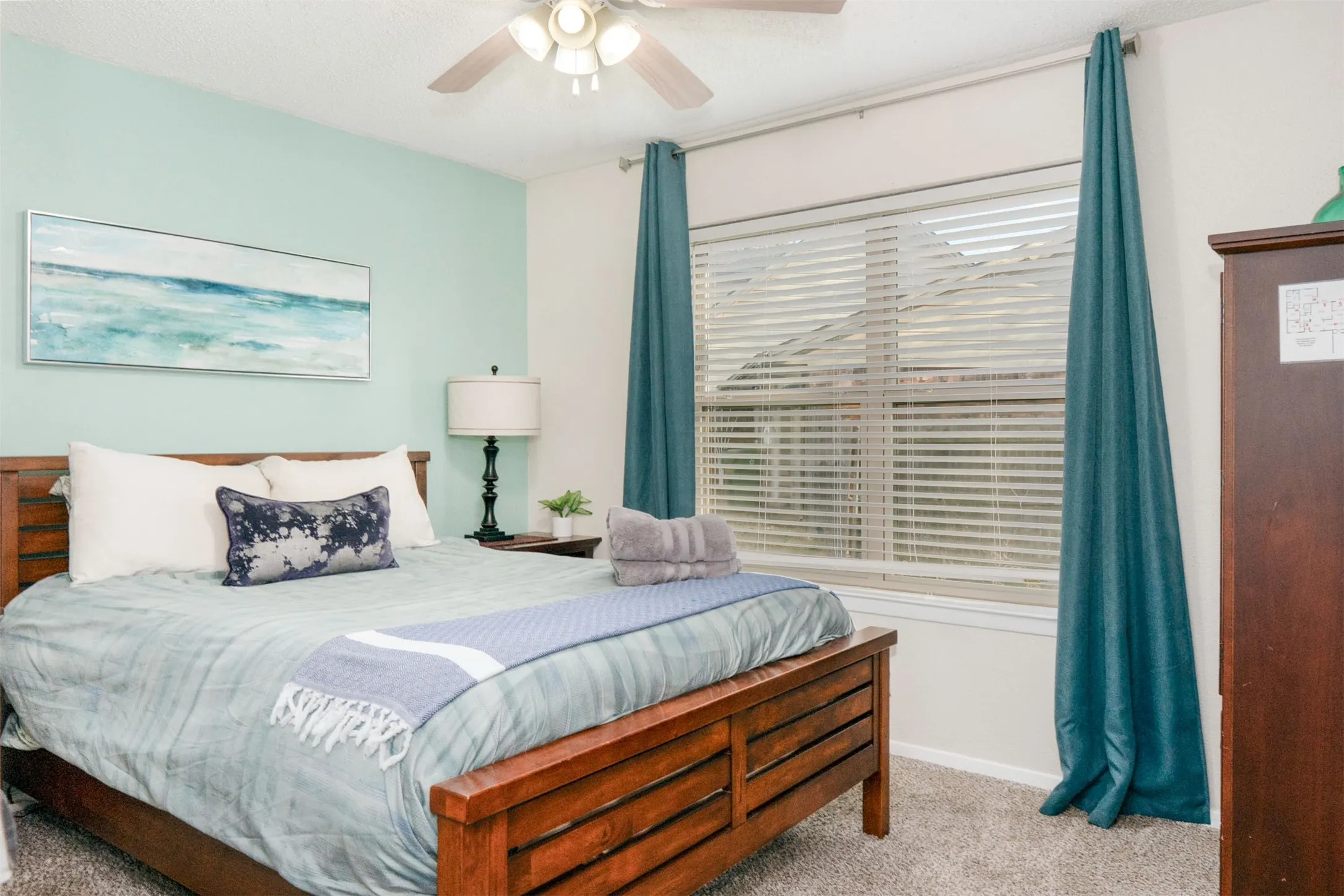 Bedroom featuring a window with blinds, a ceiling fan, and carpet flooring