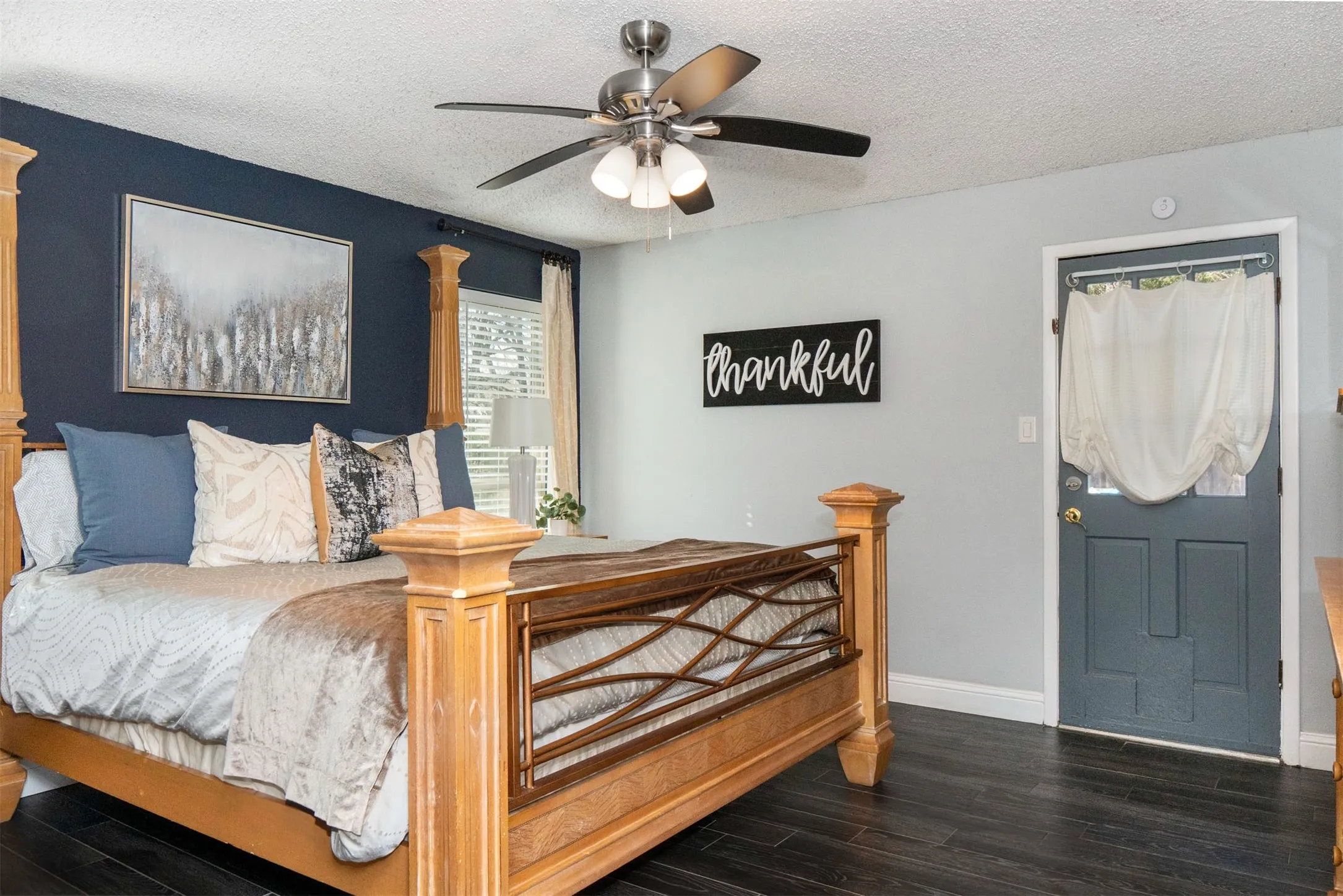 Dark wood-finish flooring complements the contrasting wall colors