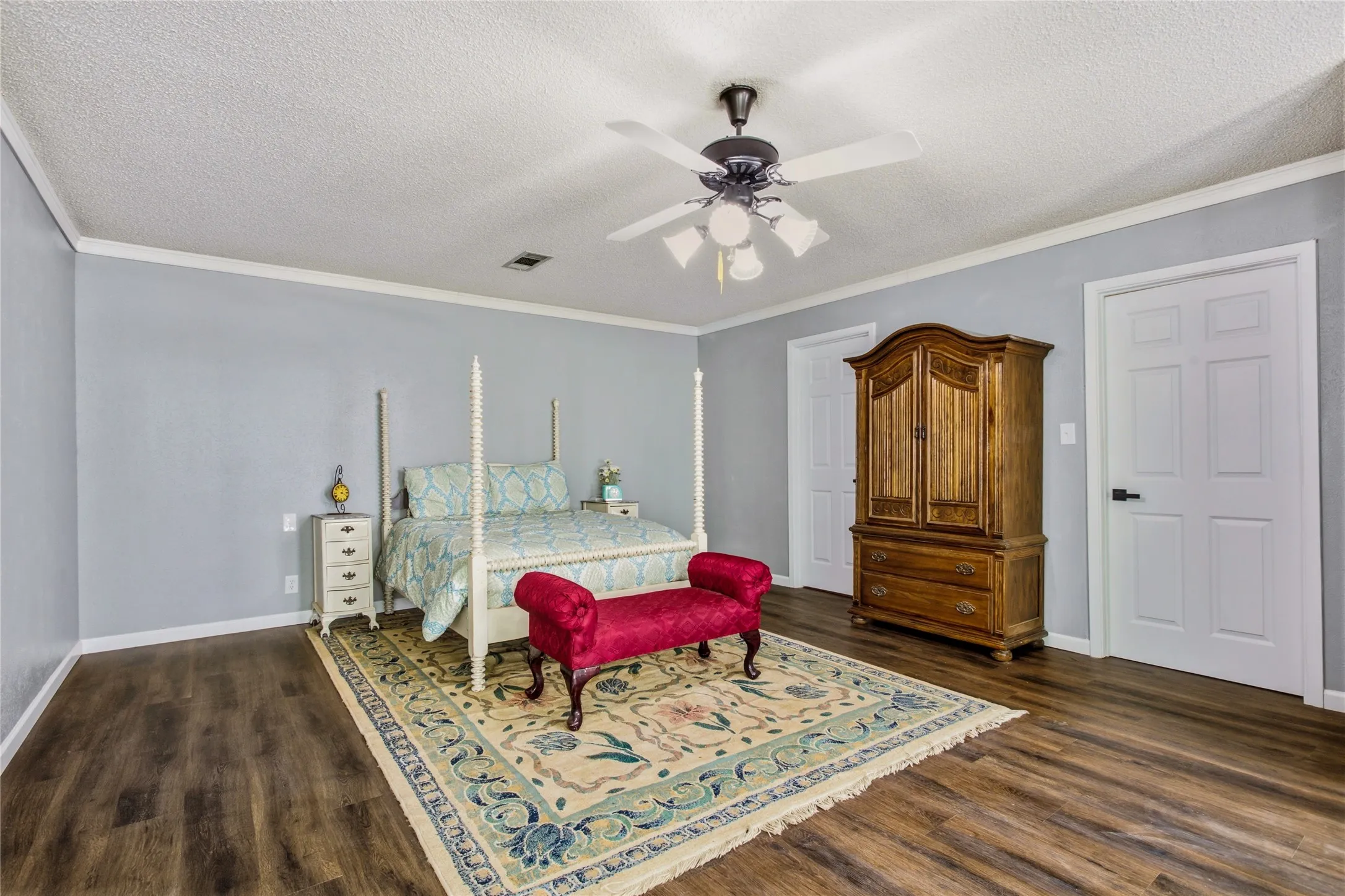 The current primary bedroom shows the double closets are spacious!  A second door was added because the closet is very long.   Plenty of room to be creTut what your bedroom needs.  That soaking tub you saw earlier is in this same room.