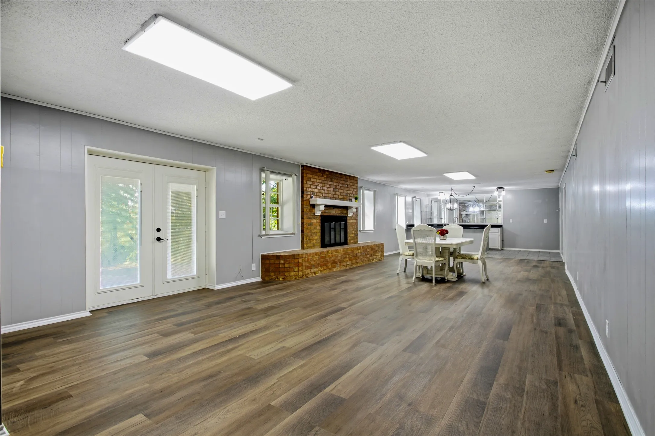This full kithen and dining area is great for your fun gatherings.  Lots of storage space here and in the pantyr to the right.  The refrigerator and stove would be on the right where you see the outlets.