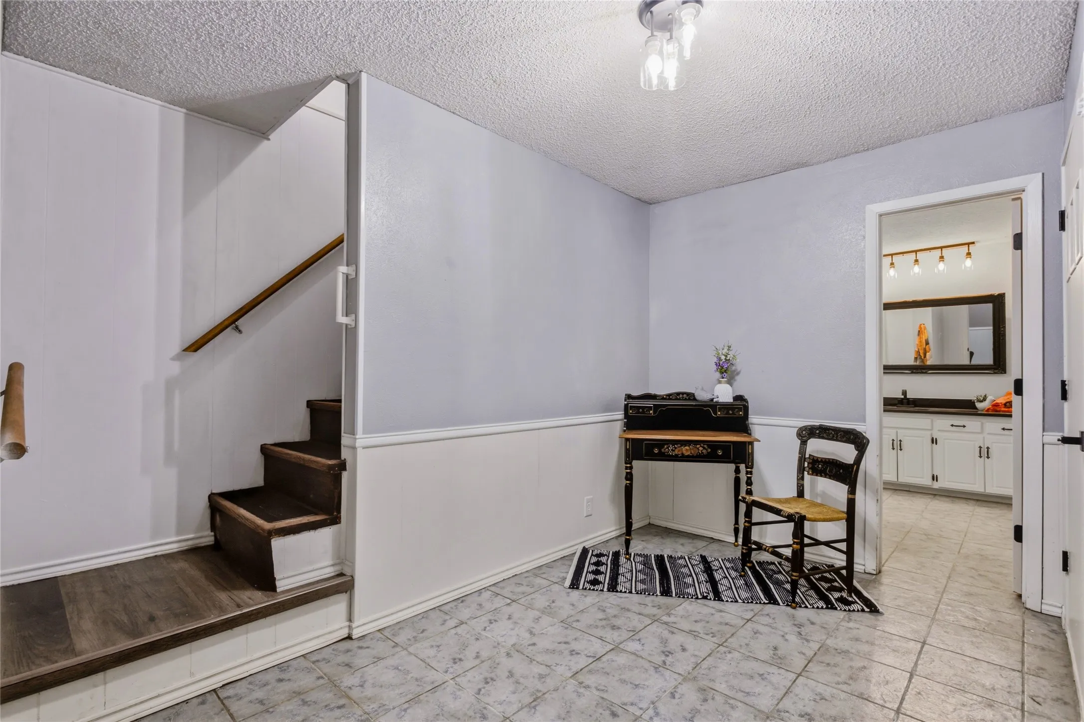 For the other two bedrooms that are downstairs, step back down to the lower level.  Here we have a small office, but it would also be a great toy room.  Through the open door, you see the downstairs bathroom.  On the other side of this room you are walking into large bedroom number 4 -  and to the great room.