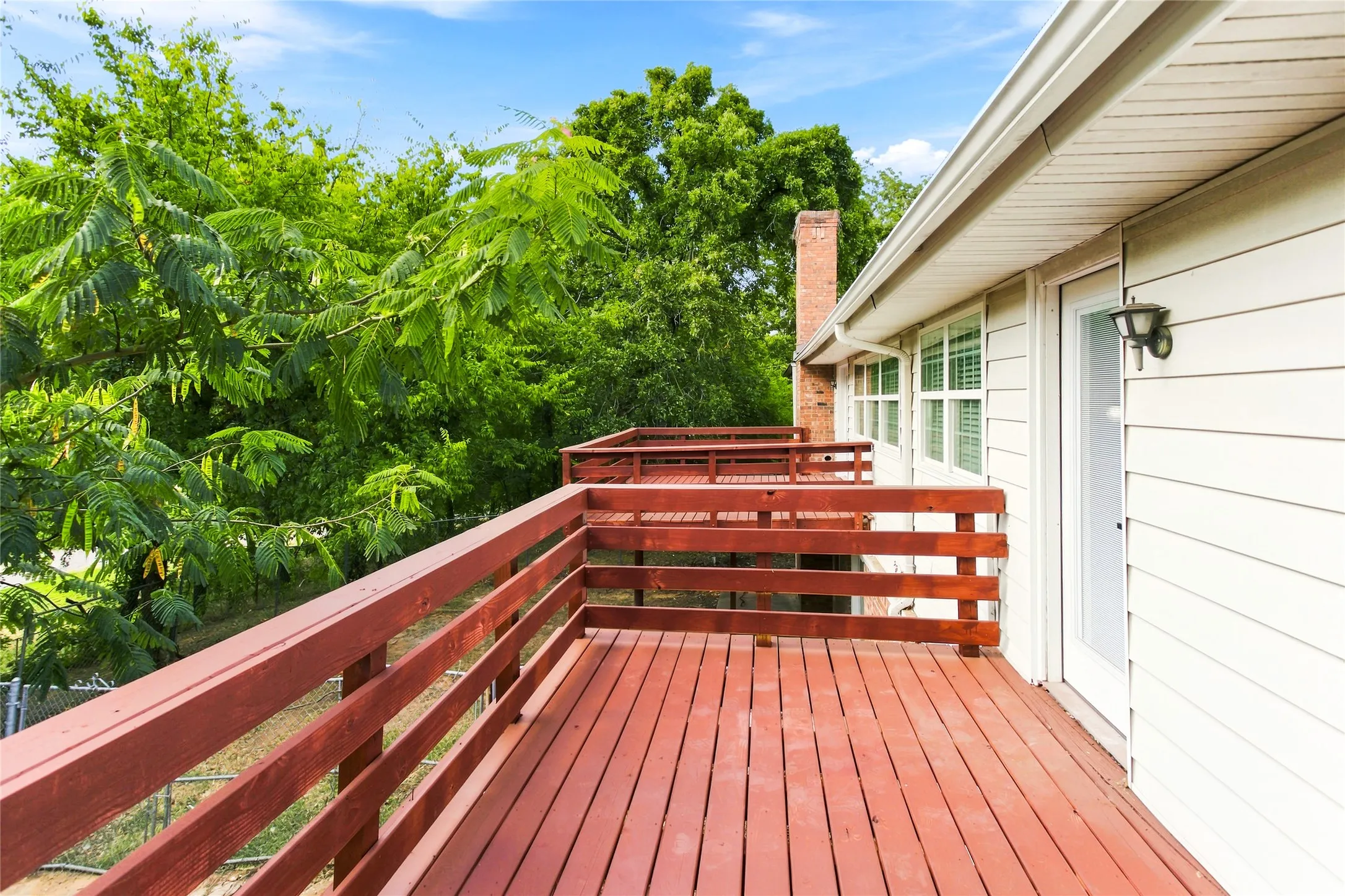 From the living room, this deck leads you to the natural private retreat.  Whether it is the place sit and relax with your morning coffee or you choose gather with friends in the great outdoors, it is a place of peace.