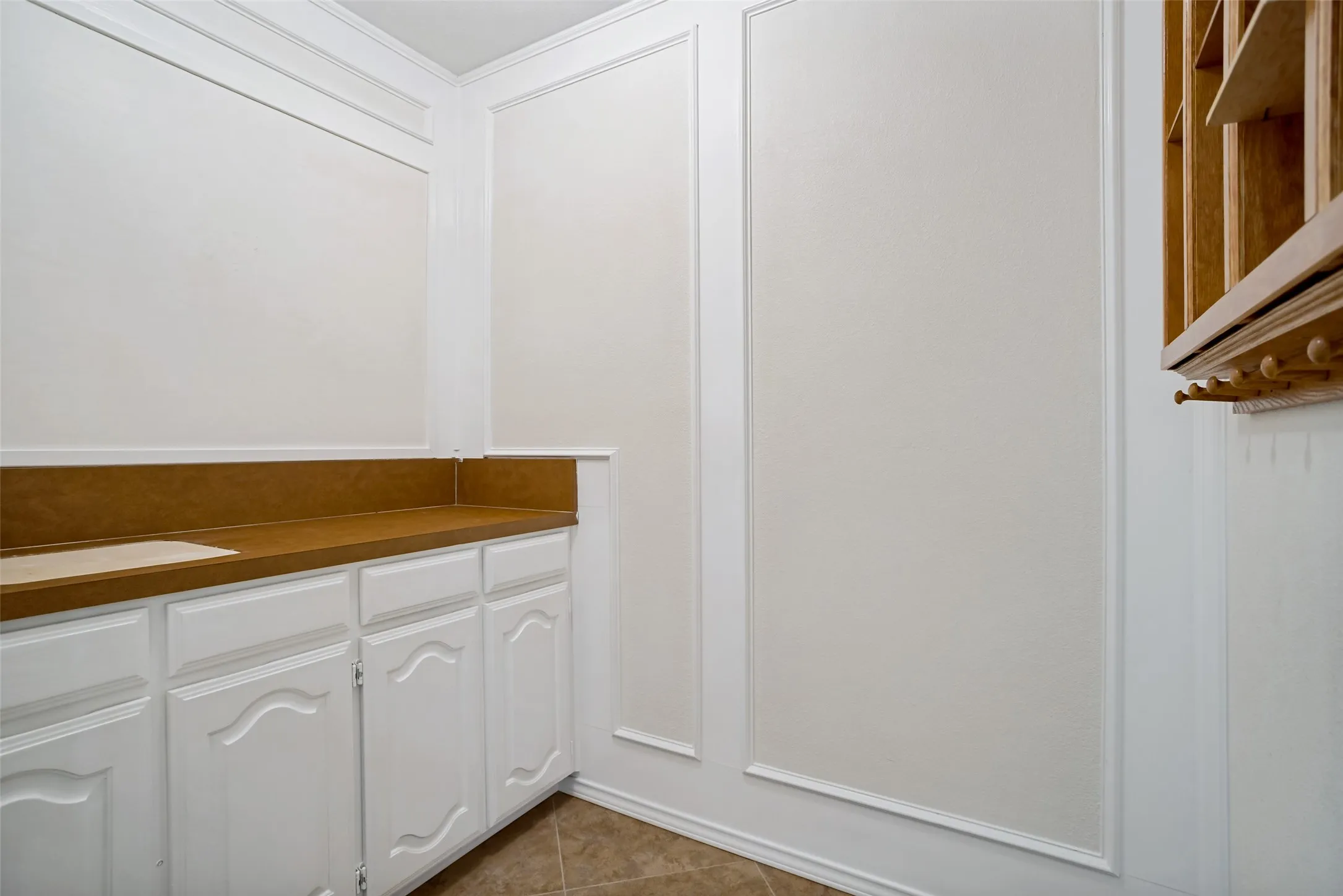 Dry bar with storage; plumbing still there for a wet bar