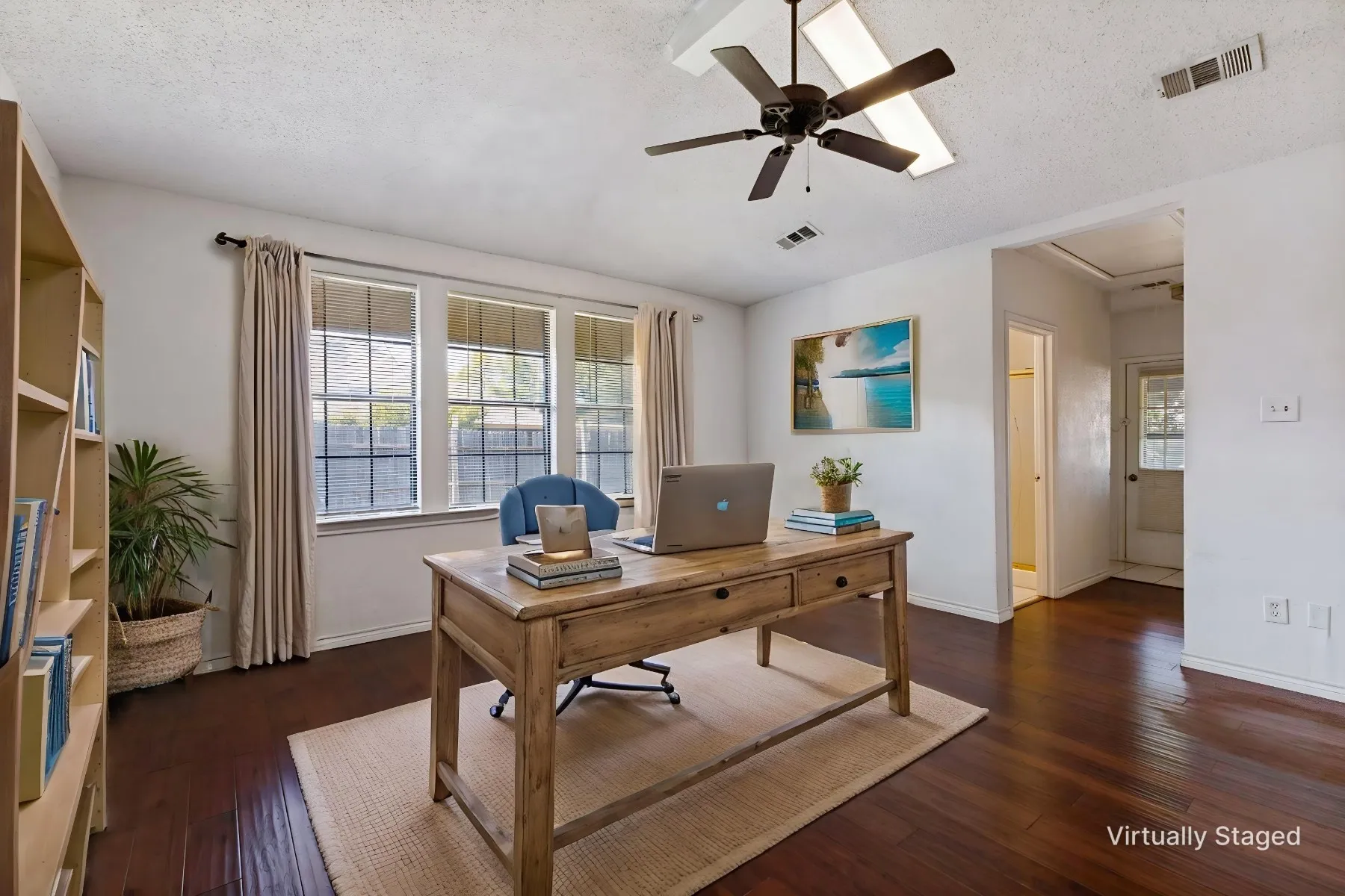 The split bedroom can also function as an office.