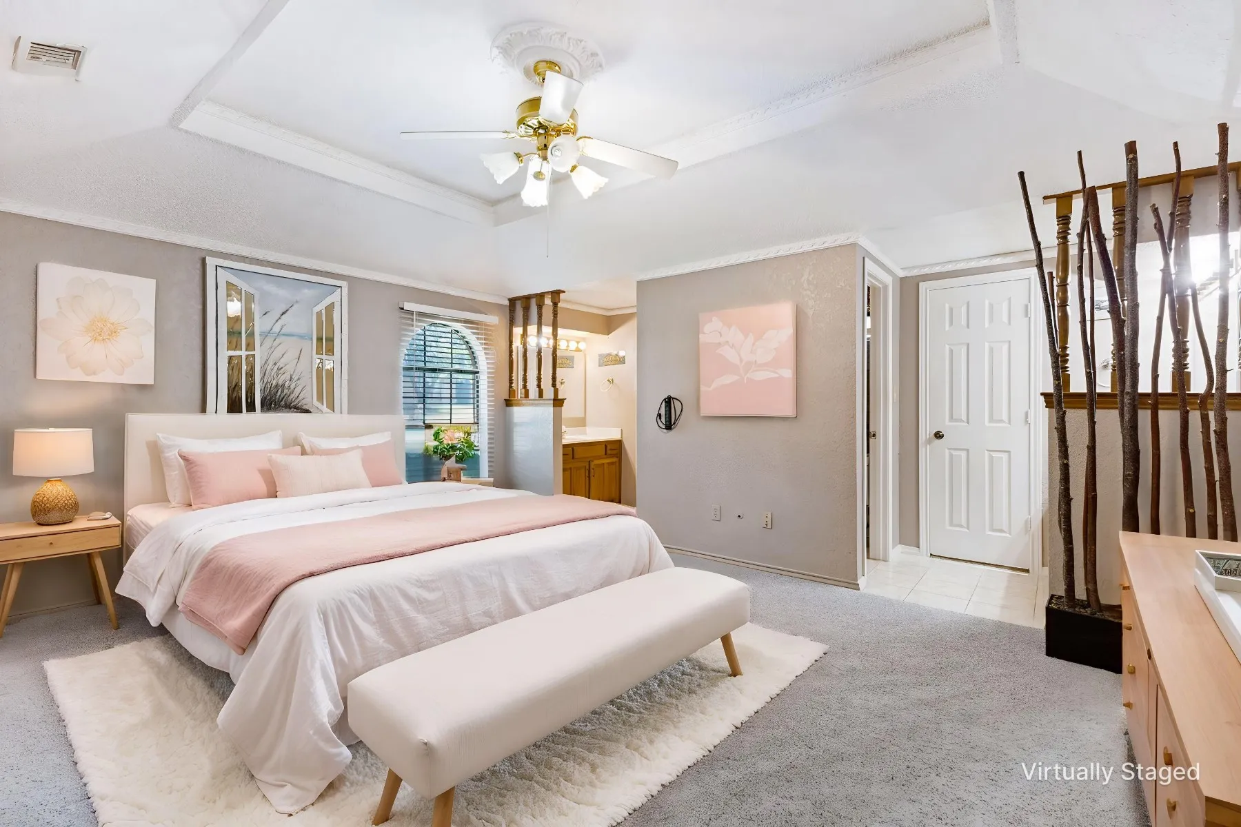 Master suite is split and features separate vanities and closets with lovely trayed ceiling and recently updated carpet.