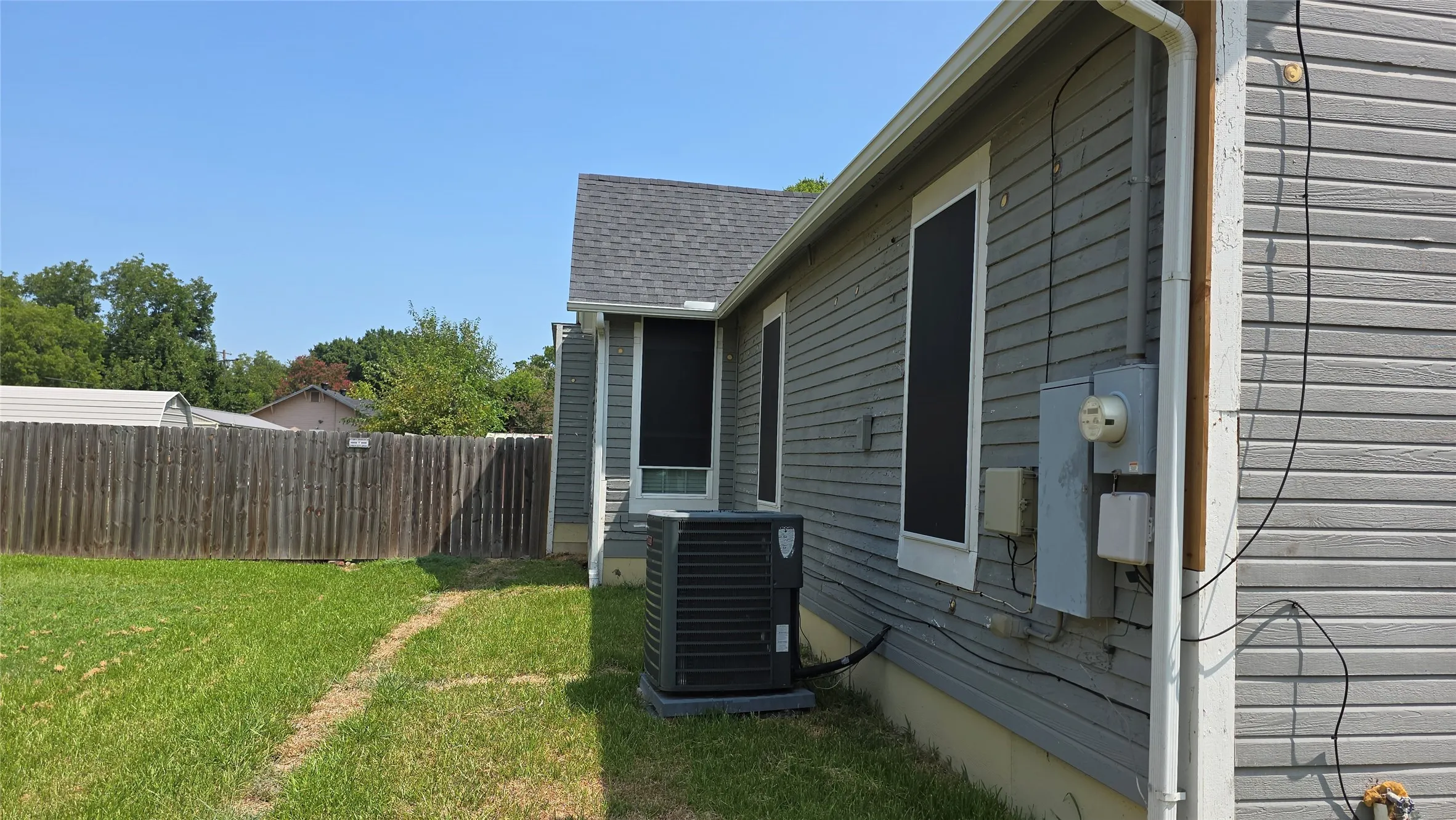 Fenced all around and access panel on side of house.