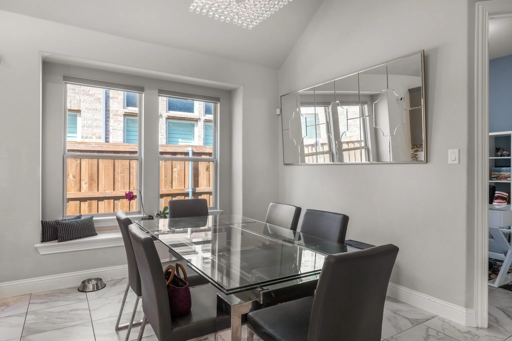 Dining area featuring a prominent window bay with a window seat