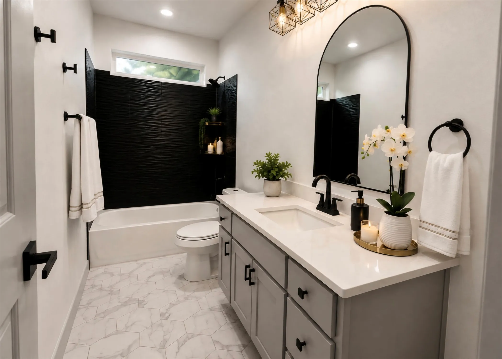 Bathroom featuring a single vanity with stone countertop, black textured accent wall in the shower, black fixtures, and geometric floor tiling