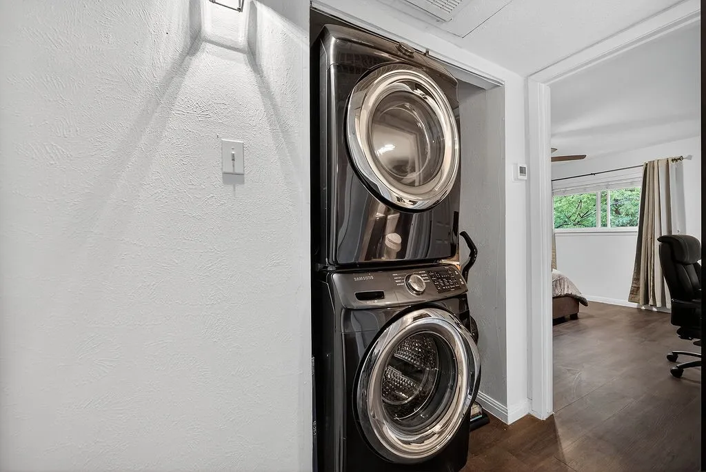Stackable washer and dryer unit in a dedicated alcove
