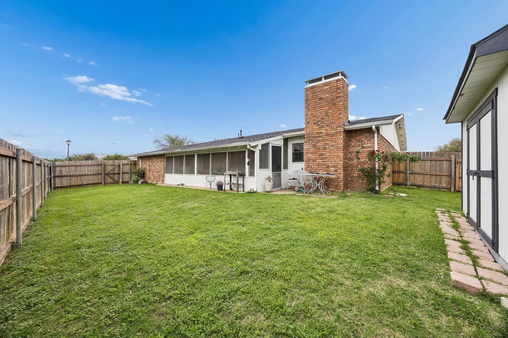 Large back yard with shed