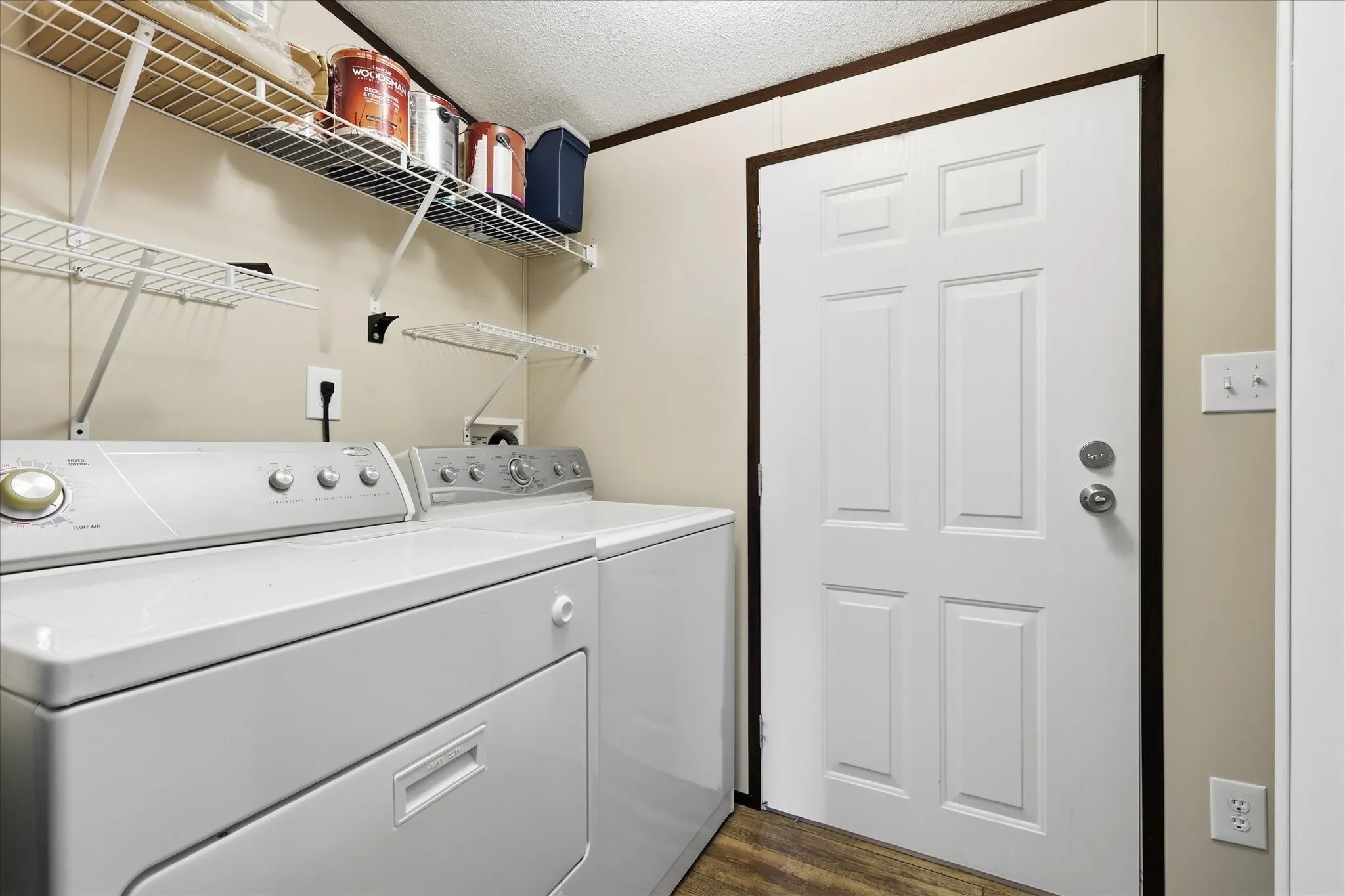 Dedicated utility area featuring white wire shelving