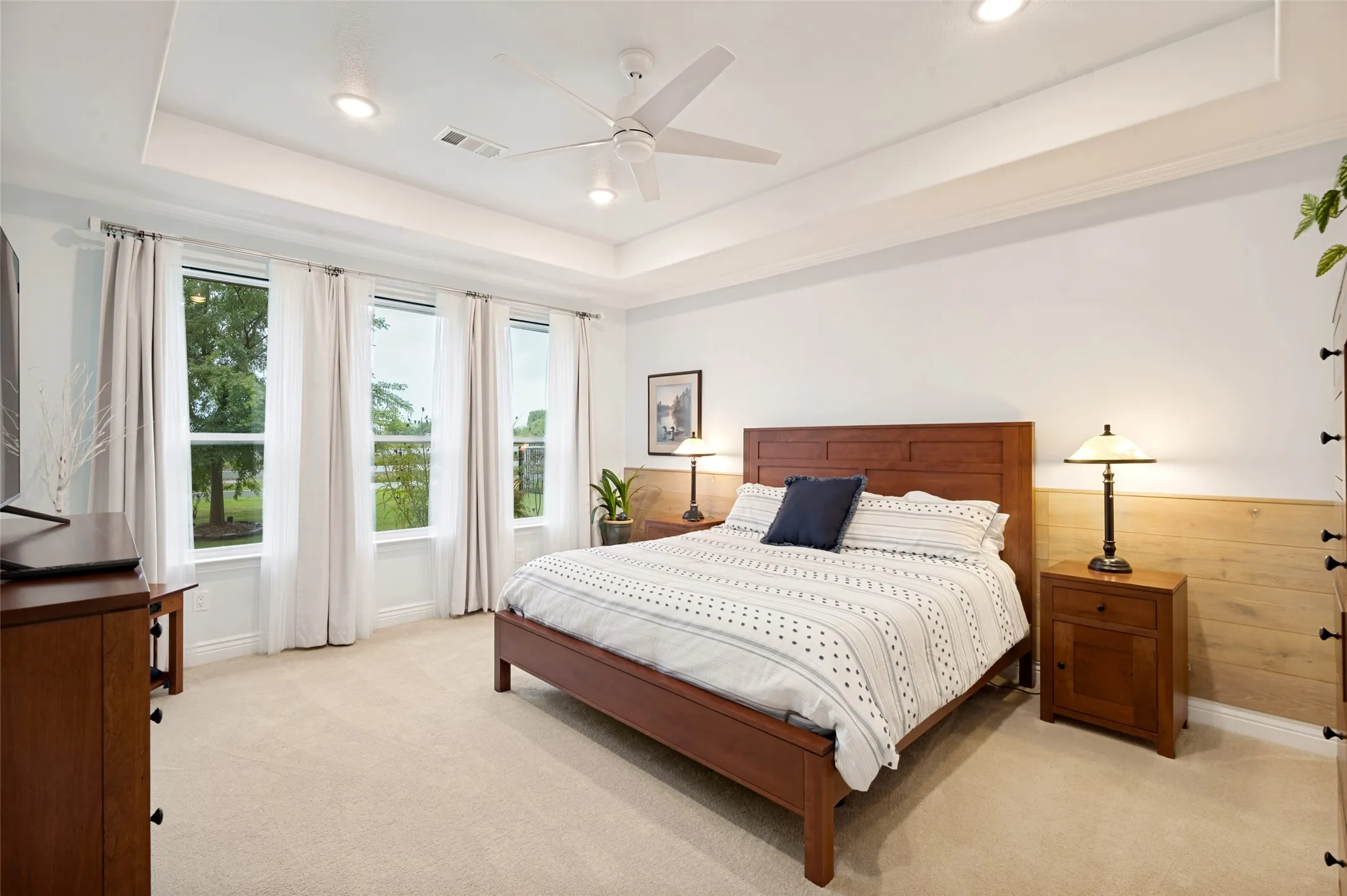 Primary Bedroom with Custom Feature Wall, and Coffered Ceiling